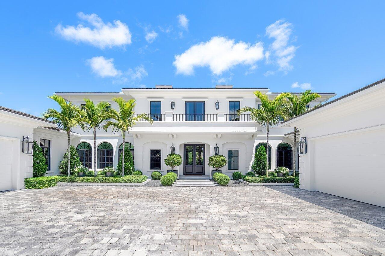 Welcome to this luxurious residence located in North Palm Beach's most prestigious community, Seminole Landing. Constructed in 2020, this stunning property spans over 12,000 square feet of meticulously designed indoor and outdoor living space, offering the perfect blend of elegance and modern convenience.As you step inside, you'll be captivated by the grandeur of the open concept living areas, flooded withnatural light and adorned with the finest finishes. Venetian plaster walls throughout the main spacesdelicately reflect the light and exude elegance and craftsmanship. Wood flooring warms up the space andprovides a visual flow between the​​‌​​​​‌​​‌‌​‌‌‌​​‌‌​‌‌‌​​‌‌​‌‌‌ rooms. The foyer, with its stunning custom starburst chandelier,
immediately opens to the living room via a large feature opening in which the jamb is clad in one-of-a-kind, reflective polished stainless metal. The living room offers classic details such as coffered ceilings, a white marble display fireplace, and floor to ceiling windows flanked with Great Plain sheer drapes, that allow for an extended view of the infinity pool and garden beyond.

Just off the living room, at the heart of this magnificent home, lies the state-of-the-art chef's kitchen, a culinary masterpiece that will inspire your inner gourmet. The kitchen is equipped with top-of-the-line appliances, including a Wolf professional-grade range, a built-in Sub-Zero refrigerator, and dual dishwashers. The expansive island, crafted from exquisite nile white quartzite in a leathered finish features a custom-designed wrap-around cantilever wood counter, which provides both ample space for meal preparation and casual dining. The custom cabinetry offers abundant storage as well as a display area with a tall, metal and glass storage cabinet flanking the range. A walk-in pantry completes this dream kitchen, making it as functional as it is beautiful. The kitchen opens to a comfortable family room, with contemporary custom built-in housing an entertainment center and providing both display and closed storage.

A formal dining room sits at the front of the house, elegantly framed by 3 large arched windows and 3 arched openings to the hallway and defined by a herringbone-patterned wood floor. A silver leaf inset ceiling and Venetian plaster walls beautifully reflect the light of this open and inviting room.

The downstairs guest suite, just off the main spaces, offers the perfect balance of proximity and privacy for visiting guests. Off white Scalamandre grasscloth wallpaper quietly textures the walls and cushions the acoustics of the room. The large en suite bathroom provides every comfort with its statement Nero Marquina marble slab shower walls and stone-clad sink vanity paired with classic white Dolomite herringbone floors. Modern Kohler brass plumbing fixtures, and a large freestanding MTI soaking tub complete this Parisian-inspired luxury bathroom.

The family room opens up to the home's entertainment areas. A game/club room includes a bar area with a Panda marble waterfall countertop and open shelving for displaying bottles and glasses. This large space allows plenty of room for gathering friends around a pool or ping pong table and opens out to the covered loggia and summer kitchen, perfect for indoor/outdoor entertaining. An adjoining powder room features textured black granite slab wainscotting on lower walls and Elitis wallpaper above. The theater room sits just off the club room. With its black fabric-covered walls, Elitis black shimmer drape, motorized, Romo Black velvet recliners, and large velvet daybeds, it is a dark and cozy haven for gathering friends and family for a movie.

As we move upstairs, a large loft offers additional space for relaxation or work. The custom built-in has 2 workstations conveniently outfitted with cord and plug access but beautifully finished with Venetian plaster, birds eye maple wood countertops, and Innovations textured wallpaper.

The primary suite, located on the upper level, is a haven of tranquility. The bedroom features a stunning bookmatched, Macabus Fantasy marble slab wall with a linear ethanol fireplace and a private balcony with breathtaking views. His bathroom has been newly renovated with Arabascato marble slab shower walls, stone vanity cladding with integrated stone sink, and matte plaster walls and cabinetry. Her bathroom is a feminine palette of Karib White marble, Waterworks plumbing fixtures, separate sink and makeup vanities, and a large freestanding tub. Expansive His and Her walk-in closets and a morning bar complete the custom amenities of this spacious primary suite.

From the luxurious living spaces to the high-end amenities, this residence offers a lifestyle of unparalleled comfort and style. The home includes a versatile recreational room for sports and family fun, an immersive theater room for private screenings, and an exercise room with state-of-the-art equipment and stunning views. The chic club room, perfect for social gatherings, seamlessly leads to the outdoor family loggia, where you can relax and entertain in style.

The outdoor oasis is truly remarkable, featuring an oversized infinity pool with an overhanging water feature, a luxurious spa, and a beautifully landscaped yard with lush grass. 
Enjoy a putting green, a summer kitchen for alfresco dining with Black Dragon marble-clad walls, and private basketball and pickleball courts. A beautifully appointed cabana bath with Elitis wallpaper seamlessly connects the indoor and outdoor areas for relaxation and enjoyment. This home effortlessly combines luxury and functionality, providing an exceptional lifestyle in one of the most sought-after locations.

Additional features of this magnificent estate include a four-car garage, downstairs and upstairs full laundry rooms, a hallway mudroom bench with hidden cabinet storage, all impact glass windows, a convenient elevator that provides seamless access to all floors and a quiet cul-de-sac location over an acre of land, offering privacy and tranquility. The home is equipped with a complete Lutron lighting system and a Crestron system, allowing for effortless control of lighting, climate, security, and entertainment through an intelligent platform.

The lush landscaping and mature oak, banyan trees, and tropical vegetation throughout the Seminole Landing community create a serene and picturesque environment. This prestigious gated community, nestled within the legendary Seminole Golf Club, offers full-time security, exclusive ocean access, and tennis courts. With only 65 single-family homes, Seminole Landing provides the beauty of prime oceanfront living with the tranquility and privacy you desire.

This exquisite residence presents a rare opportunity to own a piece of paradise in one of North Palm Beach's most coveted communities. Perfectly situated, this home is mere moments away 
from exclusive shopping destinations at The Gardens Mall, waterfront culinary experiences, renowned golf courses, and an array of entertainment options. Conveniently positioned near premier neighboring areas, travel connections are effortlessly accessible, ensuring seamless access to luxury amenities and cultural delights.