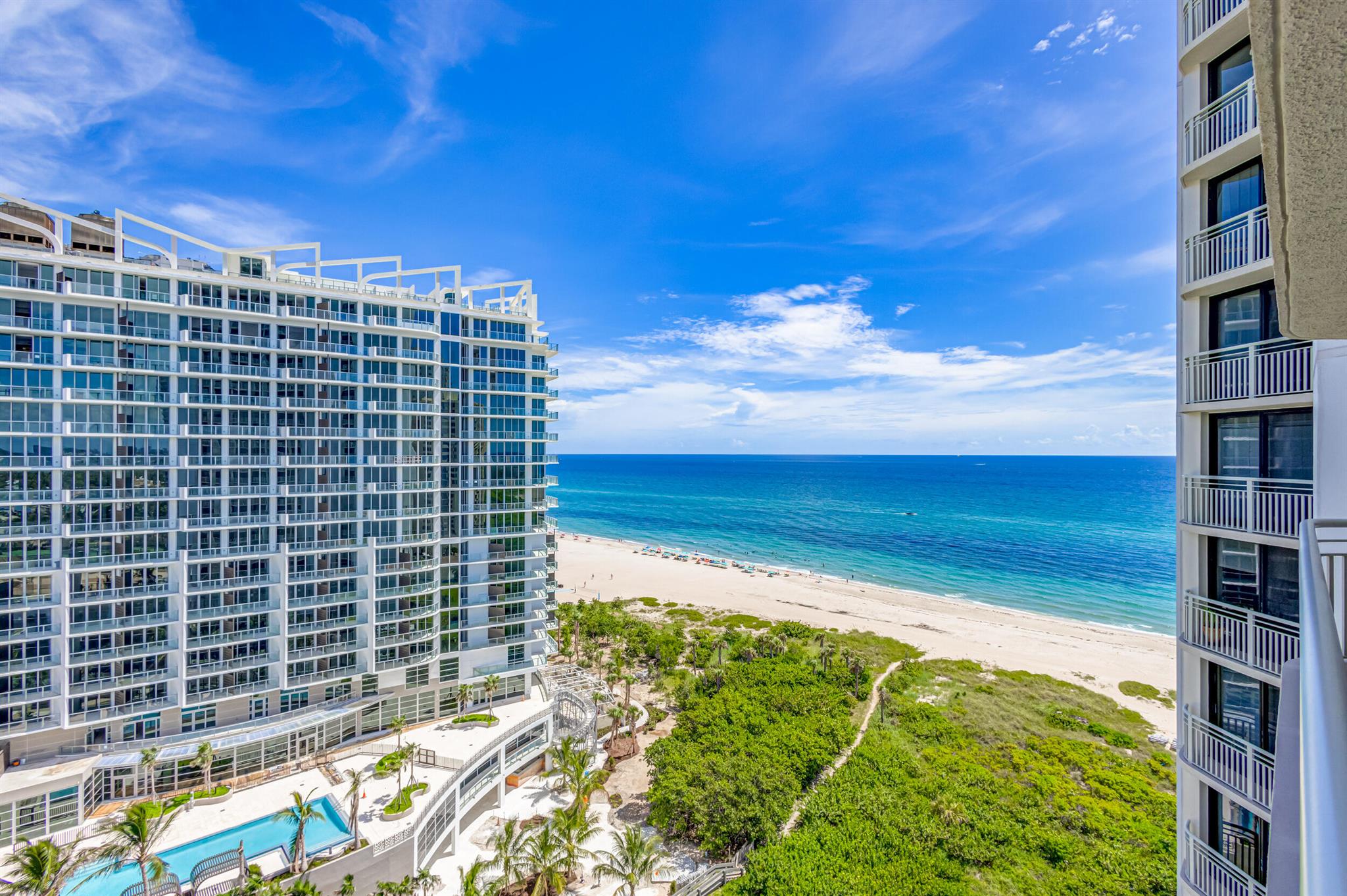 This immaculately kept unit is a coastal retreat featuring a large balcony, ocean & intracoastal views. Floor to ceiling impact sliders w/ LR & BR access. Rare opportunity to purchase neighboring unit 17A to create a custom home with resort like amenities. Unit 17B has been renovated to offer beach house living with an airy and easy feel. The custom galley kitchen has been opened up, allowing light to enter and show off the granite counters, subway tile backsplash and stainless-steel appliances. At the end of the kitchen is the extra convenience of washer/dryer inside your unit. The hardwood look of the luxury vinyl plank flooring adds to the calm vibe of living right on the sand. The spacious primary bedroom easily accommodates a king-size bed,