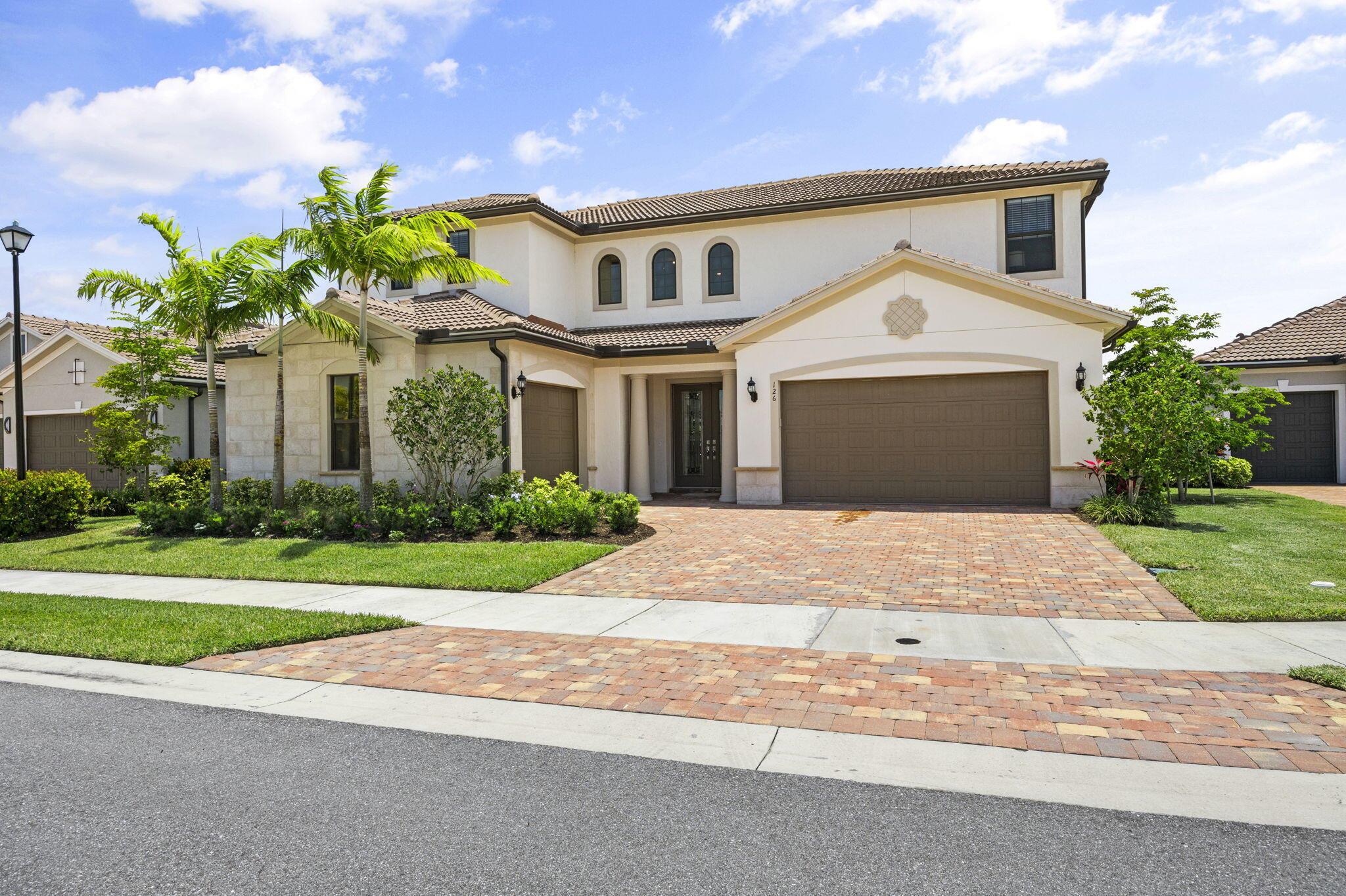 If you have been searching for a newer construction single family home with a beautiful outdoor space in an esteemed gated community, this is it!  Come visit this home in the highly sought after gated community of Sonoma Isles in Jupiter.  Sit by the pool and enjoy the gentle waterfall, the wide lake view and beautiful fountain lake.  The home boasts a grand entrance with winding staircase, soaring ceilings, loads of light throughout, an open floor plan, oversized first-floor primary bedroom with a sitting area, and tons of upgrades. When touring the home, check out the attention to detail throughout.   It's sunny and spacious and ideal for a family who will enjoy all this home and community has to offer. On the grounds you'll find tennis, pickleball, pool and playground and a clubhouse