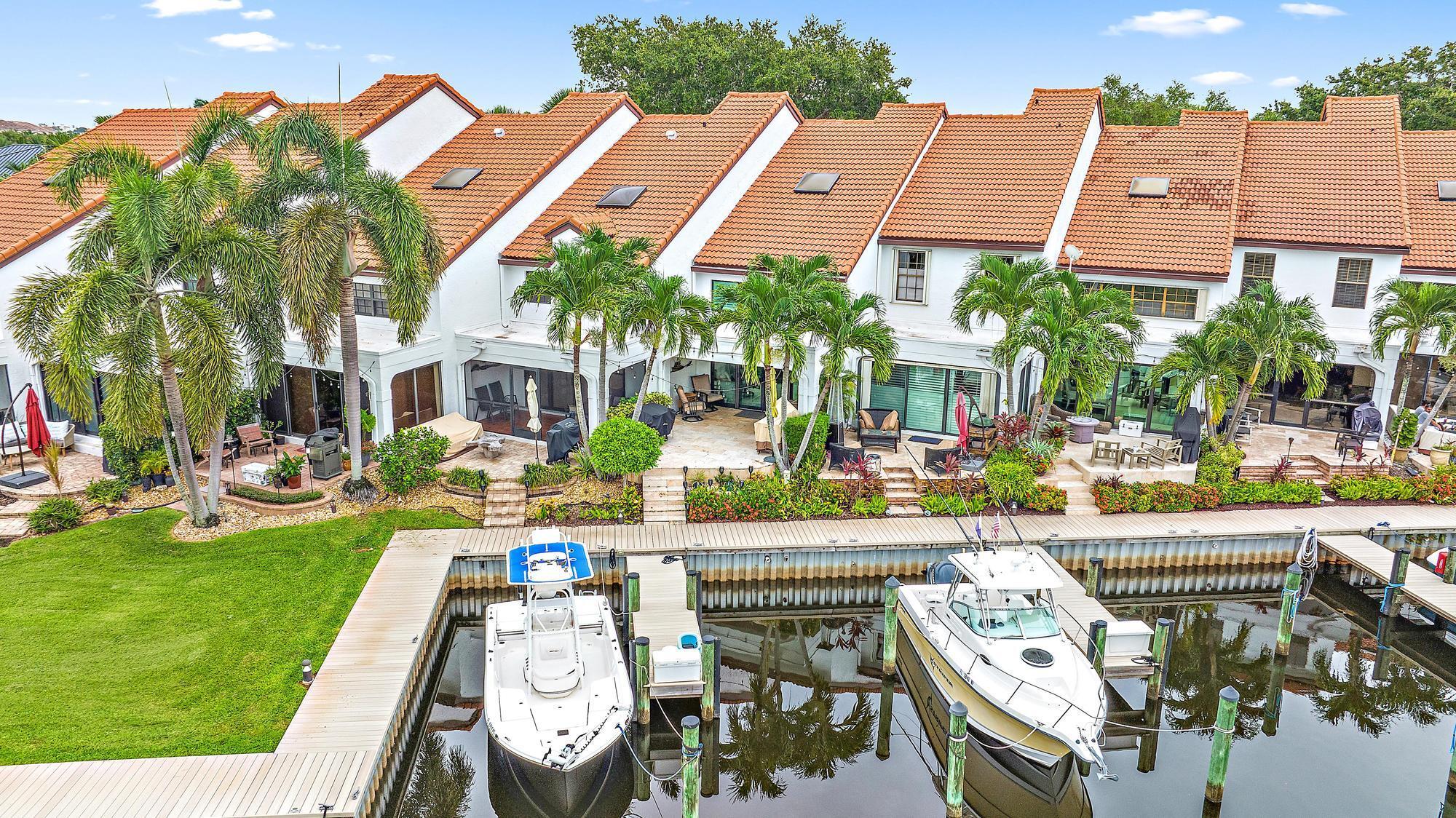 Enjoy premier waterfront living in this exceptional townhome located in the highly sought-after Mariner's Cove. Boasting captivating views of the marina basin, this townhome features 2 bedrooms plus a loft, offering a spacious & flexible living arrangement. The interior is adorned with newly installed impact glass and a renovated kitchen equipped with newer stainless steel appliances & a large Sub Zero refrigerator, white cabinets with under-cabinet lighting, granite countertops, & ample under-counter cabinet storage. The living area is open to the kitchen and impresses with a soaring vaulted ceiling, enhanced by a modern ceiling fan & impact sliding glass doors that lead to a covered patio overlooking the marina. One bedroom and a full bath are conveniently situated on the first floor... , while the master suite is privately located upstairs, adjacent to the expansive loft which overlooks the living area below. Docks are available for rent to Residents, either with direct Intracoastal access or in the protected basin, perfect for boating enthusiasts. Docks have been recently replaced and homes were recently painted. Roofs &amp; all exterior maintenance &amp; insurance are covered by the HOA. Additional amenities such as a community pool, spa, fitness center, picnic area, and clubhouse are just a short walk away, offering resort-style living at its finest. Close proximity to PGA Blvd, Juno Beach, &amp; Jupiter. Don't miss this opportunity to live the waterfront lifestyle you've always dreamed of. Schedule your private showing today.