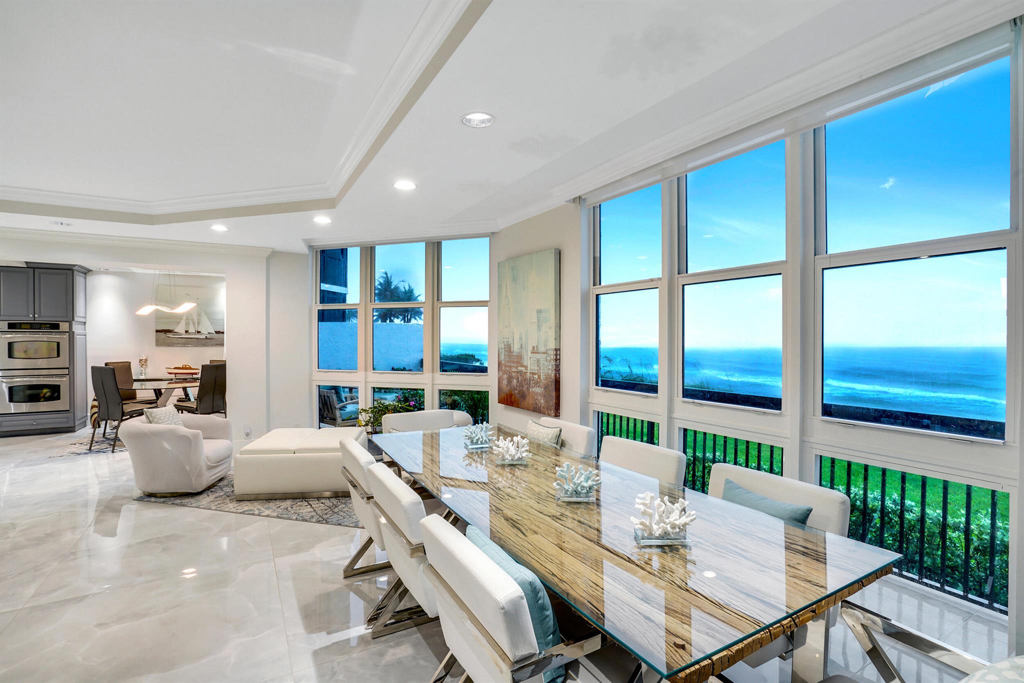 Discover the epitome of coastal luxury in this stunning ground-floor direct oceanfront southeast-facing condo on Millionaire Mile comes with boat slip, here the ambiance of a private villa awaits you. The moment you step through the double doors the panoramic views of the serene blue sea will captivate your senses. This exquisite residence features 3 bedrooms, 2.5 bathrooms and offers a generous 2,500 sq ft of living space, complete with two balconies, 9 ft ceilings, additionally condo comes with a dock slip for 32' boat. This move-in-ready condo boasts stunning Italian porcelain tiles (48''x48'') throughout the living areas, exception of the second bathroom, oceanfront windows are fitted with electric blinds, enhancing the bright and airy ambiance, full impact windows and doo Perfect for entertaining, the open-concept layout showcases a spacious kitchen island, stainless steel appliances, an eat-in kitchen area, ample cabinetry and two pantries. Enjoy your meals with a view, as the dining area offers an unparalleled backdrop of the beach and ocean.

Additional highlights include a washer and dryer set with a built-in cabinets, a powder room adorned with beautiful wall-to-wall tiles, and a master bedroom that overlooks the ocean and features sliding doors. The master bathroom is equipped with a large shower and built-in closets, a tankless water heater, and a convenient trash chute on the first floor.

Residents will enjoy gated two reserved car spaces under the building, a bike room, a storage room, and access to a gym with brand-new state-of-the-art equipment, heated pool, outdoor barbecue area and allowance for up to two small pets add to the appeal. The building itself has been recently renovated and includes a brand-new social room with a kitchen and modern furniture, doorman security, and an on-site building foreman plus Mail Room / Underground Car Wash / Air Pump to Inflate Low Tires.
 Are you ready to feel like you're on vacation 24/365?