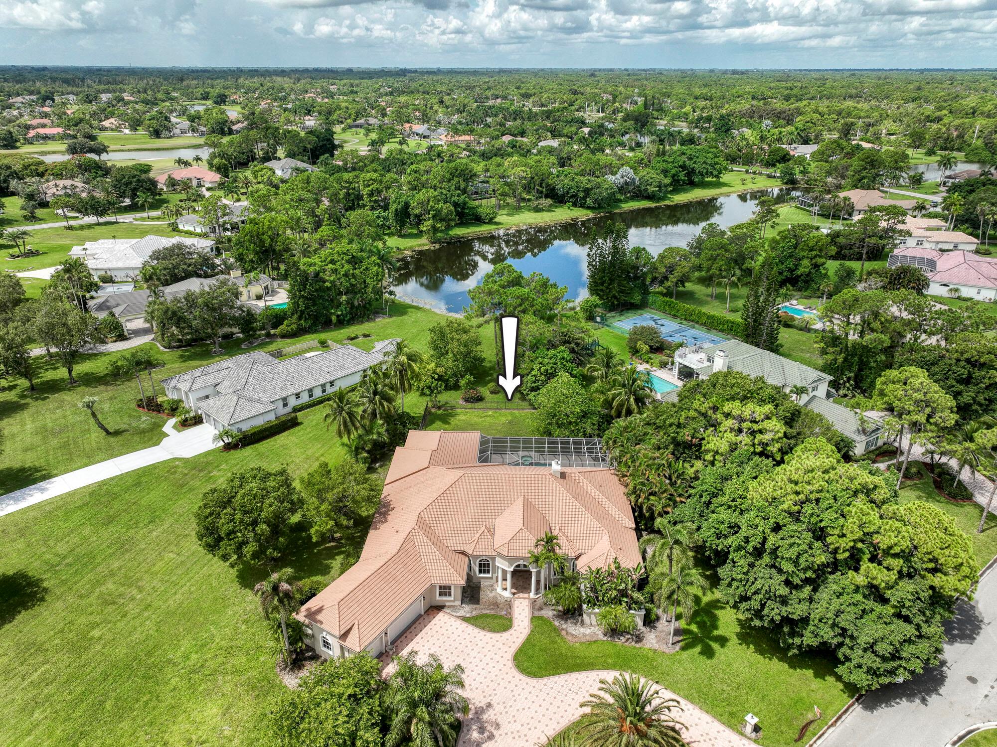 With more than 5,300 square feet under air, this Ecclestone Signature 5BR/5BA, PLUS 2 offices. All on one level and sits on a stunning 1.2-acre lot with an impressive circular driveway, in the highly desirable & luxurious community of Bay Hill Estates. The kitchen has been renovated with commercial LG appliances added in 2023, a double fridge, soft-close cabinets & drawers, quartz counters, recessed lighting, a propane stove and double oven, and a center island. An enormous in-law suite offers a living room, bedroom, and large full bath. Incredible outdoor living space featuring a 550sf covered lanai and a fully screened patio and pool with peaceful lake views. Other upgrades include marble floors in the living areas, a whole-house generator, see MatterPort VIRTUAL tour