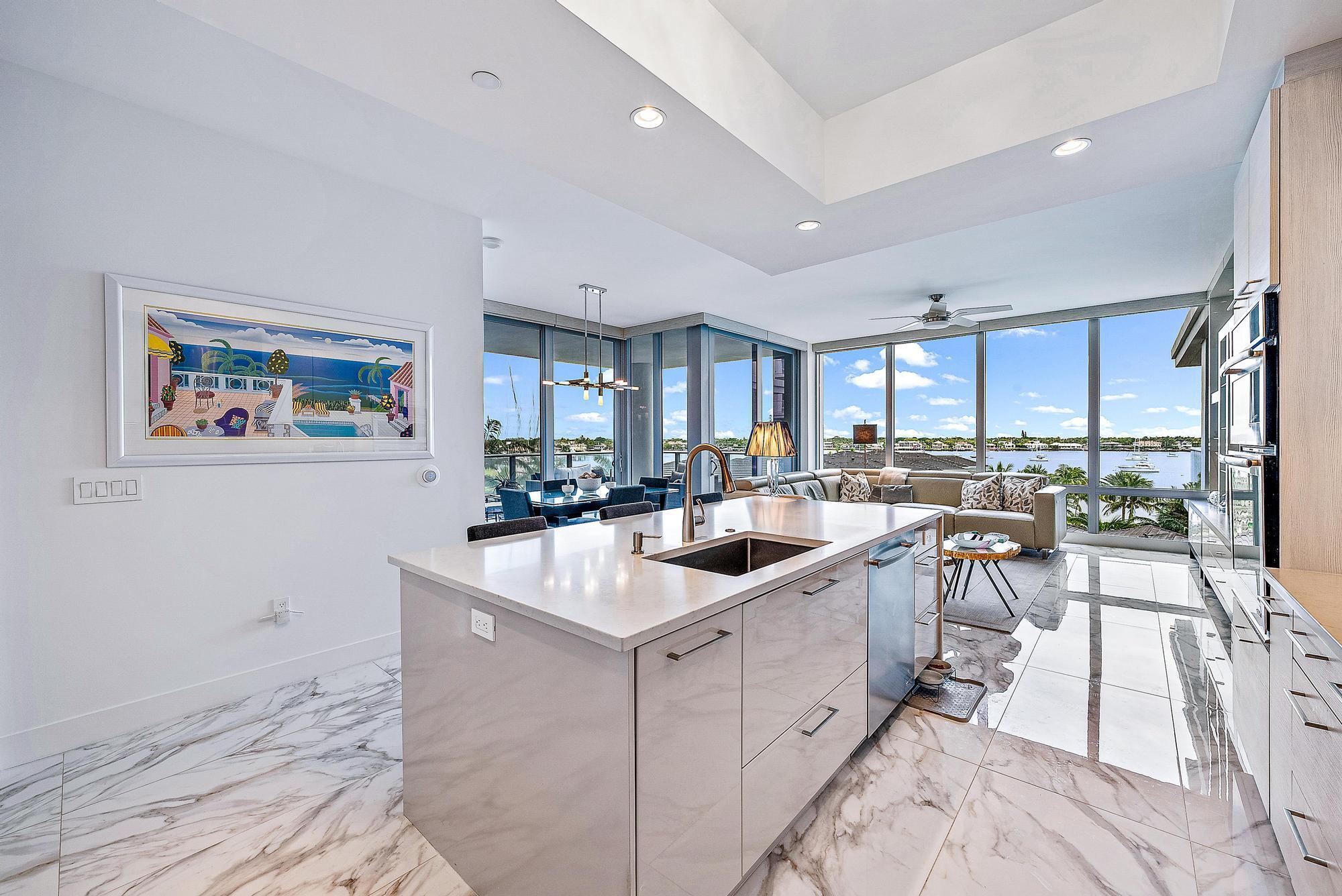 Luxury waterfront living at The Water Club in North Palm Beach. Private elevator to front door. Built in 2016, this home features 2 Bedrooms 2.5 Baths + Den. Total Sq. Ft. 2,063 & 1,728 Living Sq. Ft. Full East and Western facing exposures. New ceramic tile floor ($70,000). Impact windows throughout. 2-zoned Nest air conditioning systems. Great room has a new custom lighted wall unit with storage cabinets ($20,000) Custom motorized shades in the great room and primary bedroom. Contemporary kitchen has recessed lighting, designer wood cabinetry, quartz countertops, under mount stainless steel sink, tray ceilings, all high-end Jenn Air stainless steel appliances including cook top stove with custom hood, double convection oven with microwave, dishwasher, refrigerator and quartz kitchen... island that easily seats 4. Living room has floor to ceiling windows that overlook the intracoastal with a sunrise view and sliders to tiled covered wrap patio.
Dining area has sliders to tiled covered patio with intracoastal views.
Primary suite has sliders to private tiled covered balcony, with sunrise views.
Primary bath has his and hers vanities with quartz countertops, make up area, glass enclosed separate shower, contemporary soaking tub, separate water closet and double glass doors leading to large walk in closet with built ins. Private foyer leading to den and guest suite. Den has sliders leading to private balcony with sunset views. Guest suite has built-in closet and sliders to private balcony with sunset views. Guest bath has single vanity with quartz counter tops, and glass enclosed shower. Powder room has single vanity with quartz counter tops. Laundry has front load Whirlpool washer and dryer, utility sink and storage cabinetry .Amenities include a private clubhouse, resort-style pool, spa and a lap pool overlooking the water. The 5,000 sq. ft. clubhouse features casually elegant gathering areas, a fully equipped fitness center, free wi-fi, and a yoga/Pilates studio to rejuvenate body and soul. Family and friends will enjoy the lush tropical foliage, outdoor kitchen, two fire pits, sculpted beach and social areas at your private oasis at the water's edge. Water Club's dedicated boat slips or mooring at the adjacent Old Port Cove Marina, provide direct, deep water access to Palm Beach Inlet, the Atlantic Ocean and beyond.