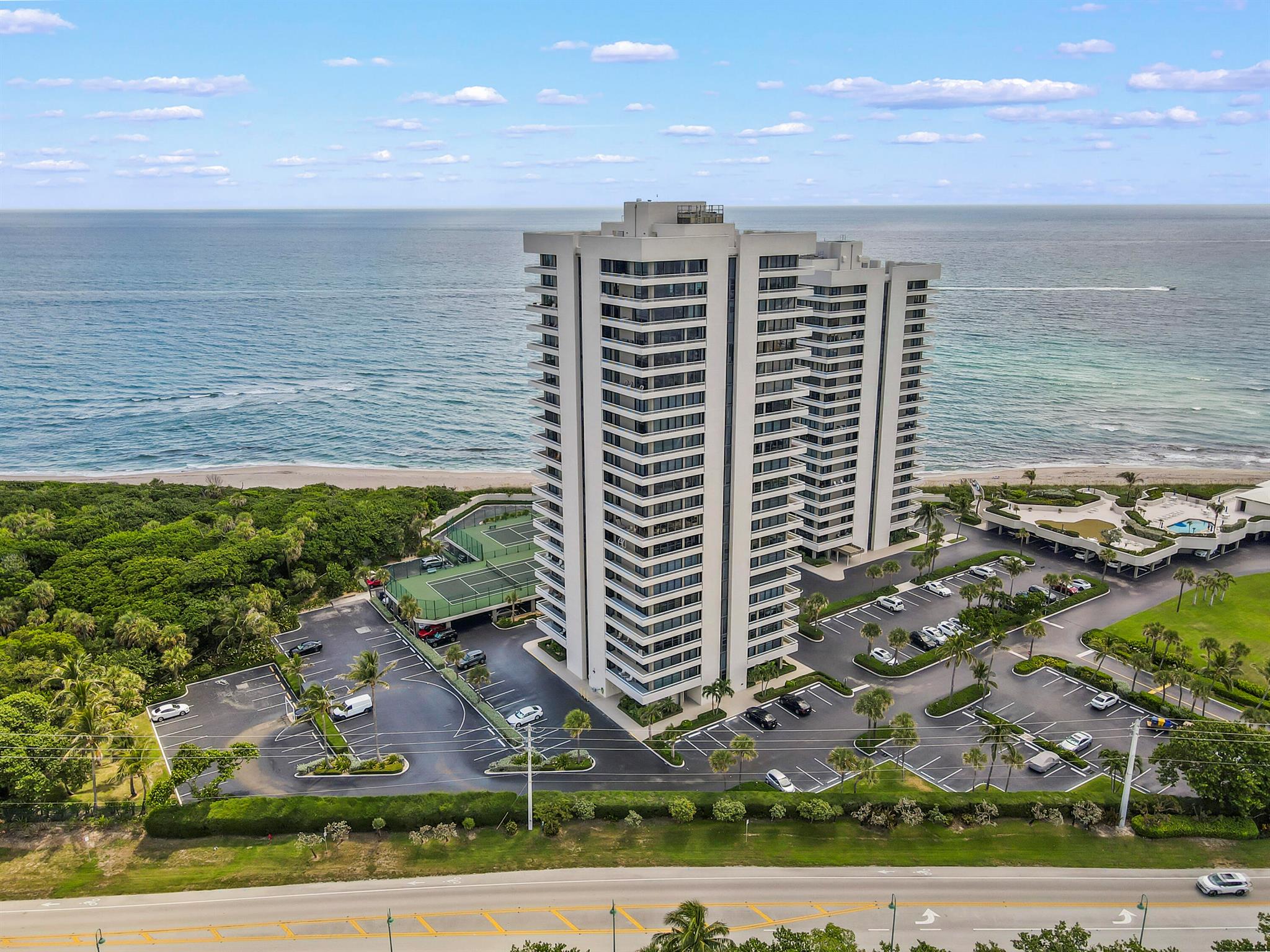 Experience elevated coastal living in this beautifully updated corner condo, where every detail is designed to impress. Enjoy private, panoramic views of the Intracoastal Waterway, MacArthur State Park, and the ocean from expansive floor-to-ceiling impact windows.This exquisite residence boasts elegant 24-inch travertine flooring throughout--no carpet to be found--and features glass French doors in both bedrooms that open into the spacious great room, enhancing the breathtaking views from every angle. The white contemporary kitchen is a chef's dream, fully open with a large round eat-in bar, granite countertops, tile backsplash, and stainless steel appliances. Both bathrooms have been thoughtfully renovated with marble-tiled walls, granite tops, and a frameless glass shower door in the master suite, providing a spa-like retreat.
Residents of this exclusive building benefit from 1,025 feet of private beach frontage, two heated pools, four tennis courts, and a beautiful recreation deck with an owner's lounge offering stunning ocean views. Additional amenities include shuffleboard, a fitness center, a putting green, and a car rinse station. The 24-hour manned guard ensures security and peace of mind.
Step outside to explore Singer Island's renowned outdoor activities, including visits to Peanut Island, paddleboarding, kayaking, biking, fishing, and snorkeling. With extended sidewalks perfect for walking, running, or biking, this location offers endless opportunities for an active and enjoyable lifestyle.