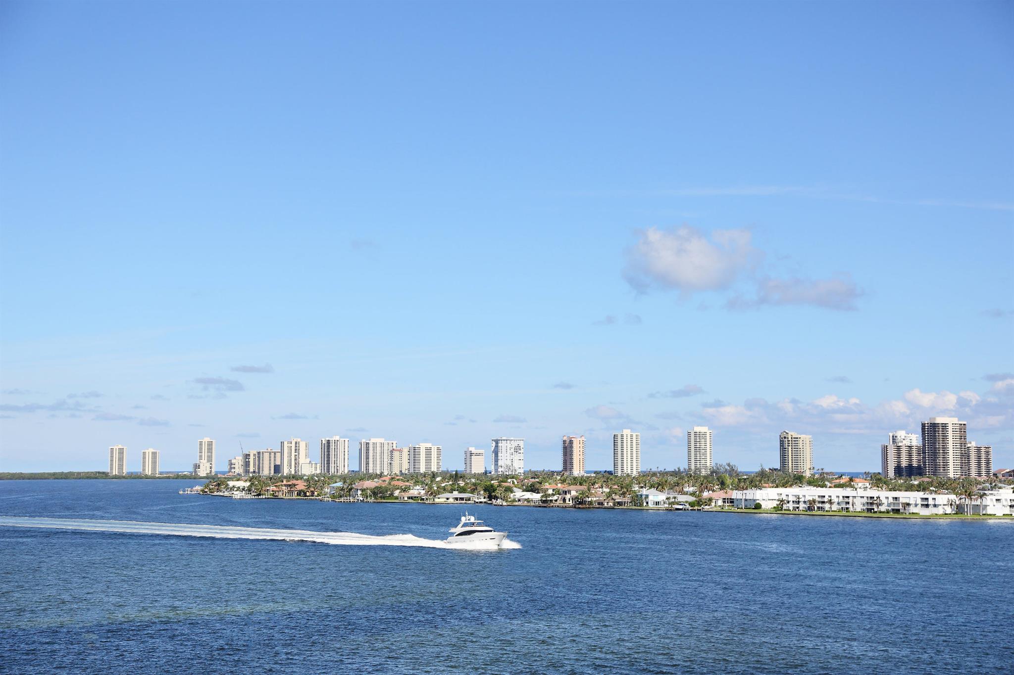 Beautiful expansive views of the ocean and Intracoastal from this desirable 3 bd 3 ba waterfront condo. Water views from every room. Hurricane impact windows and doors. Newly remodeled  kitchen with so many upgrades including newer porcelain flooring throughout.(NO CARPET) Newer light fixtures. Laundry room with newer washer and dryer. This unit comes with assigned garage parking. Endless amenities include sauna, steam room, lockers, fitness center, pool, hot tubs, BBQ areas with ocean views, 4 pickleball courts, tennis courts, billiard room, social room, card room, nautical room, library, gated with manned security and valet parking. 20 minutes from PBI airport, close to the public beach, Publix grocery store across the street and a full service Marina next door. Perfect location!