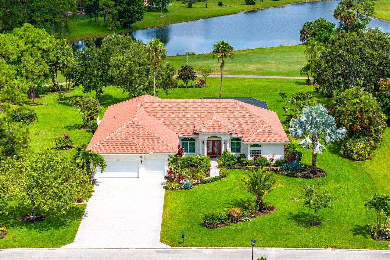 Fabulous move-in ready 5 BR + office, 4.5 BA home with pool on a stunning 1 acre lot in Bayhill Estates. This one story home offers 3,600 SF of living space with a split floor-plan and magnificent views of the18th hole of the PGA Estate Course and a sparkling lake. Generously sized rooms and 24'' porcelain tile give the home a modern feel. The updated kitchen opens to the family room and breakfast area, all overlooking the tranquil lanai and golf course. Large primary suite with 2 walk-in closets and luxurious renovated bathroom. All other bathrooms have been renovated as well. The outdoor living is just as stunning as the interior with a pool with lanai that was replaced in 2015, lush landscaping and lighting and plenty of yard space beyond. Enjoy ease and peace of mind with so many thoughtful updates including a freshly painted exterior, complete impact glass windows, 2024 garage door, 2022 roof and much more. This home checks all the boxes and is truly a must see!This home checks all the boxes and is truly a must see! 
Bay Hill Estates is a manned guard gated community of approximately 250 beautiful single-family homes on 1 acre lots in a pleasant environment with walking paths along flowing canals and lakes with low POA fees providing cable TV and internet, a 24 hour staffed security entrance and maintenance of the common grounds. An 18 hole golf course, owned and operated by PGA National, is located on the premises. There is no mandatory membership, but if homeowners choose to, they can opt for a PGA golf or social membership.