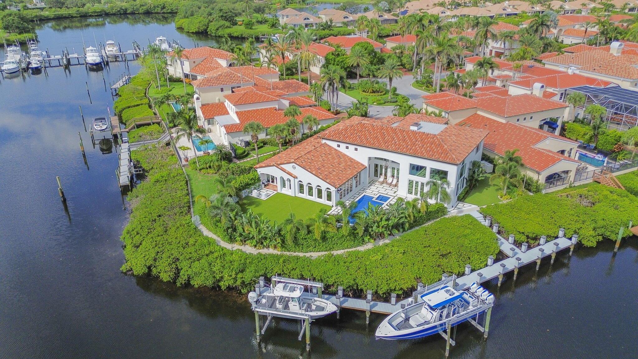 Welcome to 3299 Bridgegate Drive, a meticulously renovated deep waterfront pool home in the prestigious Jonathan's Landing Country Club, Jupiter Florida. This expansive 5-bedroom residence, plus an office or potential 6th bedroom, offers 6.5 bathrooms and exudes luxury and sophistication at every turn. Designed with both elegance and comfort in mind, the home features a thoughtfully crafted floor plan filled with natural light that seamlessly connects formal and casual living spaces, making it perfect for grand entertaining or serene family gatherings.The gourmet kitchen is truly the heart of the home, boasting ultra high-end appliances, custom cabinetry, and an expansive island that provides ample space for culinary creations and casual dining. The luxurious owner's suite is a private oasis, complete with two walk-in closets, an en-suite bathroom with dual vanities, a soaking tub, and a separate steam aromatherapy shower. Start your day with a moment of tranquility on your private patio, savoring your favorite morning beverage. The home also offers four additional spacious bedrooms, each with its own en-suite bathroom, ensuring comfort and privacy for family and guests alike. The office, or optional 6th bedroom, also includes an en-suite bathroom, making it a versatile space that can adapt to your needs.

This home is a showcase of exceptional features, including all impact windows and doors, a brand-new raised seawall leveling the backyard, and a new dock that can accommodate an 80-foot-plus boat. The property is equipped with two 24,000-pound boat lifts, a refinished saltwater pool with a new heater, pump, auto-fill, and auto-drain system, four new coastal Trane air conditioners, three new water heaters, a whole-house generator, and a 1,000-gallon propane tank. Each bathroom in the home is outfitted with steam showers featuring aromatherapy, air tubs, and a wood-burning fireplace, adding to the luxury experience.

Outside, the Florida lifestyle unfolds before you with breathtaking water views from your own backyard. Take a dip in the pool, relax in the spa, or enjoy the spacious green areas. With direct access to the water, your private dock offers endless possibilities, whether it's boating, jet skiing, or paddleboarding.

This is a rare opportunity to own a piece of paradise in Jonathan's Landing, a country club community where membership is optional, not mandatory. Conveniently located near I-95, the Florida Turnpike, Palm Beach International Airport, and premier shopping and dining, this home seamlessly combines luxury living with everyday convenience. Don't miss your chance to make 3299 Bridgegate Drive your new home&#x14;schedule a private showing today and experience the pinnacle of Jupiter living. Additional features include a 2019 roof, cul-de-sac location, and no fixed bridges.