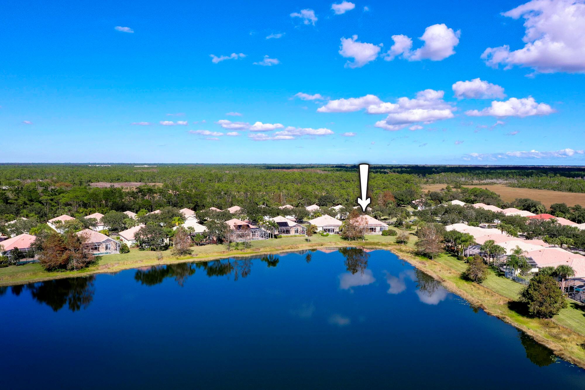 Unmatched and spectacular lake and nature views with Southern exposure from this (200k +) upgraded 4/3 open plan on private corner locale. Too many upgrades to list, including Marble/Granite/Porcelain finishes, Thermador & Bosch, & Generator. Discover the ultimate in lakefront living with this beautifully designed home, nestled on a premium lot in the coveted Carleton Oaks community. This 4-bedroom, 3-bath residence offers a smart 3-way split layout, blending elegance and functionality. The formal living and dining rooms exude warmth with Brazilian cherry floors, soaring volume ceilings, and tasteful moldings, all bathed in soft, welcoming tones. At the heart of the home, the centrally located kitchen is a chef's dream, featuring a convenient pass-through to the dining room and views while relaxing under the heavy-duty Sunbrella awning, with the added ambiance of outdoor speakers. The luxurious master suite is a true retreat, boasting a renovated en-suite bath with dual sinks and a vanity and spacious California-style walk-in closets. The suite also offers private access to the enclosed patio, creating the ideal space for peaceful moments. Designed with comfort and security in mind, this home includes accordion hurricane shutters, a 1,000-gallon gas-powered whole-house generator with automatic switch, a 2-car garage, A/C- 10 years old, Water Heater 3 years old. The property's premium location offers extra land and unmatched privacy with no neighboring home on one side. Set in a gated community surrounded by a vast nature preserve, residents enjoy a tranquil environment that's a haven for wood cranes and storks. Carleton Oaks also features top-notch amenities, including tennis courts, a pool, a playground, curbs, and sidewalks. This home is the epitome of picture-perfect Florida living, offering both beauty and serenity in an exclusive setting.