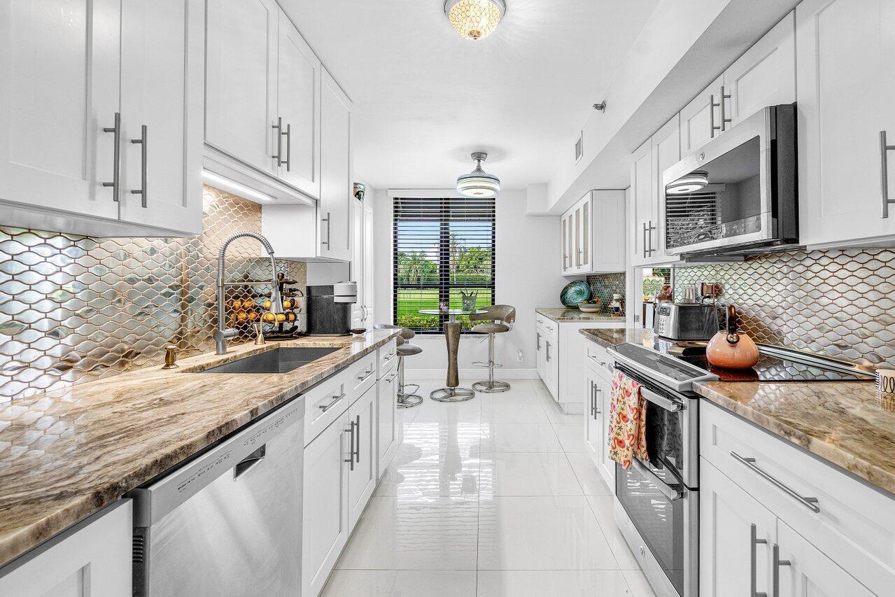 Breathtaking Golf Course and Lake Views - Fully Renovated 1st Floor Corner Unit.  Discover a rare gem in the heart of Boca Raton! This beautifully renovated, move-in-ready 1st-floor corner unit offers stunning, unobstructed views of the golf course and lake. With direct walkout access, you can enjoy the serene outdoors right from your home.  Located in a secure, 24/7 manned guard-gated community with roving patrols, this home offers unparalleled safety and peace of mind. The neighborhood's prime location puts you close to all that Boca Raton has to offer.  This unit is perfect for both investors and seasonal residents, with the ability to rent out from the first year, and optional country club membership. The modern kitchen features all stainless steel appliances.NEW airconditioner.