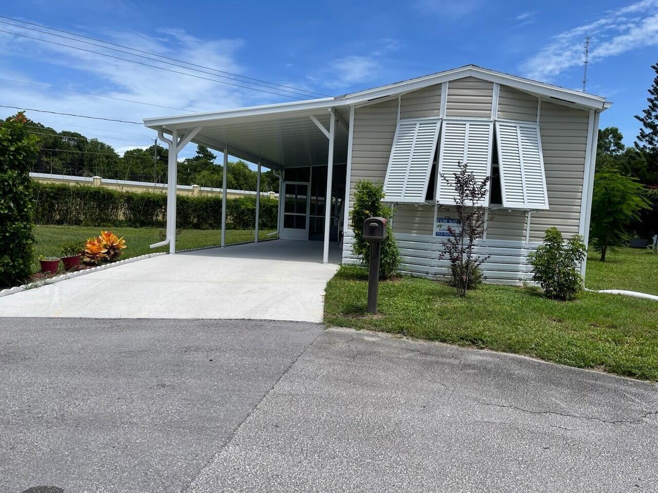 Nicely updated manufactured home 2bed/2bath in the 55 and over Spanish Lakes One. Newer A/C 2021, Newer roof 2022, accordion shutters, sliding door replaced 2021,Bahama shutter windows on all exterior windows of the house installed 2021. Washer/Dryer newer 2021, Hard vinyl plank floors in living room & main bedroom. Tinted film on front room windows. Blinds in all other windows, newer microwave in 2021.Lot rent includes lawn care, trash removal, sewer and all amenities. Amenities include golf, 2 pools, tennis, pickleball, bocce, shuffleboard, billiards, game room, party room and much much more. Many clubs and various activities are available. You can do as much as you want or just sit by the pool and relax. Great location close to restaurants and shopping centers. Schedule your showing