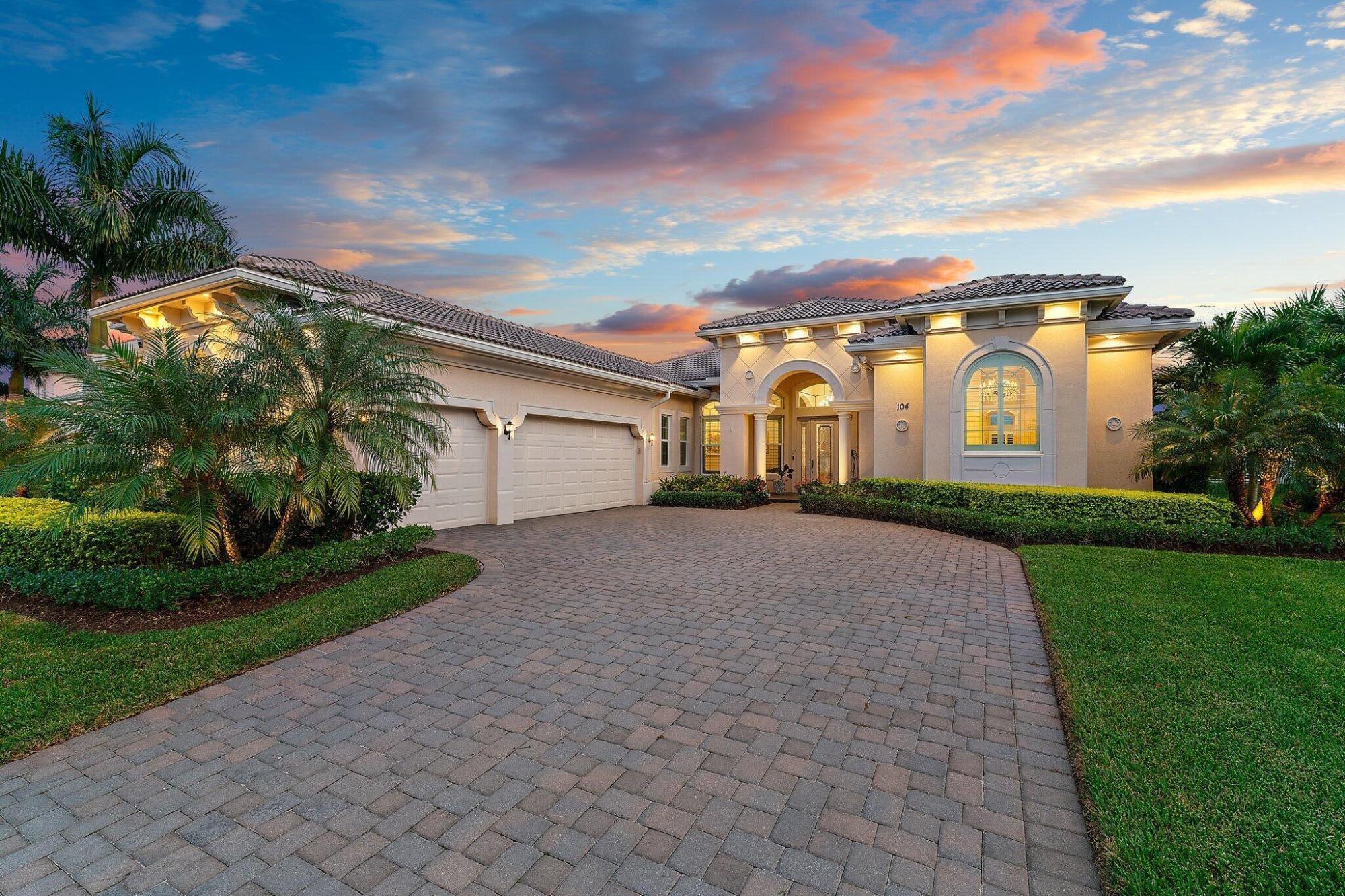 This house is 6 years old in the prestigious Jupiter Country Club! This popular ''Castania'' floorplan was built in 2018. The house model is the largest one level house in Jupiter Country Club and in the best area of JCC for a one- level house. With a beautiful and open floor plan, the house is very bright, light and airy! Upon entering into the house, one immediately sees through a large picture window the very attractive outdoor area. This area includes a large 15' x 26' pool and 7'x7' spa with an enhanced waterfall. The back area of the house is adjacent to hole #8 of a Greg Norman Signature Golf Course. The front of the house faces a large pond with a fountain and there are no houses on the other side of the street.

The house has a built- in Security System + Remote Controlled Fireplace. Solid CBS Construction is Enhanced w/Injected Insulation to the 15' roofline The house has hardwood flooring, Impact windows/doors and energy efficient natural gas. The Master Bedroom Suite is spacious and private with dual closets and a separate shoe closet, a luxurious bath and a private entry from seating area to the pool. Additional design elements include all solid core doors, coffered ceilings with 8 chandeliers and LED lighting.

The formal living room with stunning picture window offers dramatic views and abundant natural light upon entry. This one-level house has 4 bedrooms and 4 bathrooms in which the two guest bedrooms have ensuite bathrooms. This model has a "split bedroom" style, with the large Master Bedroom Suite.

The hub of this flawlessly designed home is the kitchen and family room. This true 'Chef's' kitchen boasts custom wood cabinetry with top tier lighted glass and an expanded seating peninsula. Top of the line appliances and Quartz counters and backsplash add visual appeal and functionality to this culinary area. The family room with a fireplace and built-in library creates a comfortable seating area. Surrounded by windows, the room opens to the picture-perfect outdoor lanai, pool area and full summer kitchen.

The very contemporary kitchen has an expanded peninsula-type quartz counter that can accommodate 6-8 chairs comfortably, and a host of attractive appliances. There are exceptionally beautiful hardwood floors throughout, with stunning marble floors in all bathrooms. The 26'x 15' salt water pool is among the largest in JCC and is enhanced by a 7'x7' Jacuzzi spa with waterfall. The house has a three-car garage with a large driveway.

The premier southern exposure keeps the pool in the sunlight. Golf and lake views offer majestic serenity. Enjoy this Prime location within JCC, the serene Partisan enclave of 18 total homes. Enhanced by professional landscaping and night scaping, this property truly embodies the best of a healthy Florida lifestyle, offering the perfect balance of luxurious interior living and serene outdoor comfort. The house is perfect for entertaining. Jupiter Country Club is North County's newest golf community and members enjoy national reciprocal privileges with the 'Invited' network of Clubs. The community is graced by lighted sidewalks throughout - great for walking, close to best beaches. Other features include "A" rated schools, great shopping, great dining and closeness to PWI Int'l airport. See Photos and Documents for additional details on this home and JCC amenities. All of the furniture is new.

Since buying the house, the owners have made the following improvements: 1. Added a whole house water filtration system. 2. Added an Instant Hot water faucet to the kitchen sink counter. 3. Changed the two shower enclosures that had shower curtains to frameless glass enclosures. 4. Added additional landscaping to an already good landscaping in the front and back areas. 5. Added three Chandeliers. 6. Added pictures with good frames throughout the house. Pictures are either coastal or northwest scenery. Stocked house with tools, ladders and essentials. 7 Painted the house including garage even though house did not need painting. 8. Thoroughly cleaned house after house was painted. 9. Bought high quality indoor and outside furniture, and the Social membership charge is very low. The Sway Restaurant offers good food in an attractive setting at relatively low prices.

The price is negotiable and although the house is offered fully furnished, there is additional price flexibility if the buyer chooses not to purchase the furniture.