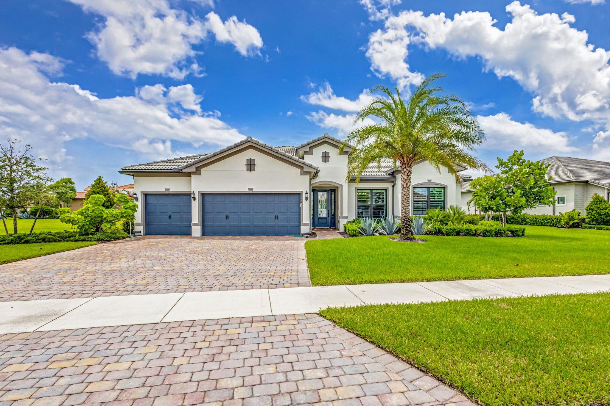 Unparalleled Elegance in this 2021, 4 Bedroom, 3 Bathroom with Office Waterfront Home on an Oversized Lot in the Prestigious Ancient Tree Community. This Distinguished Residence is the Epitome of Luxury Florida Living, Perfect for both Indoor and Outdoor Entertaining. A Well Appointed Chef's Kitchen Features Top of the Line Stainless Steel KitchenAid Appliances, Gas Range, Custom Island, Upgraded Cabinetry and Wine Bar. An Open Floor Plan Accents a Great Room filled with Stylish Designer Finishes like a Coffered Ceiling, Crown Molding, Wood Floors and Zero Corner Sliders that lead into a Spacious Two Zone Screened Lanai complete with Gourmet Summer Kitchen and Breathtaking Sunsets. The Primary Suite is Adorned with Spacious His & Hers Walk-In Closets with Built-Ins and a Lavish Bathroom.