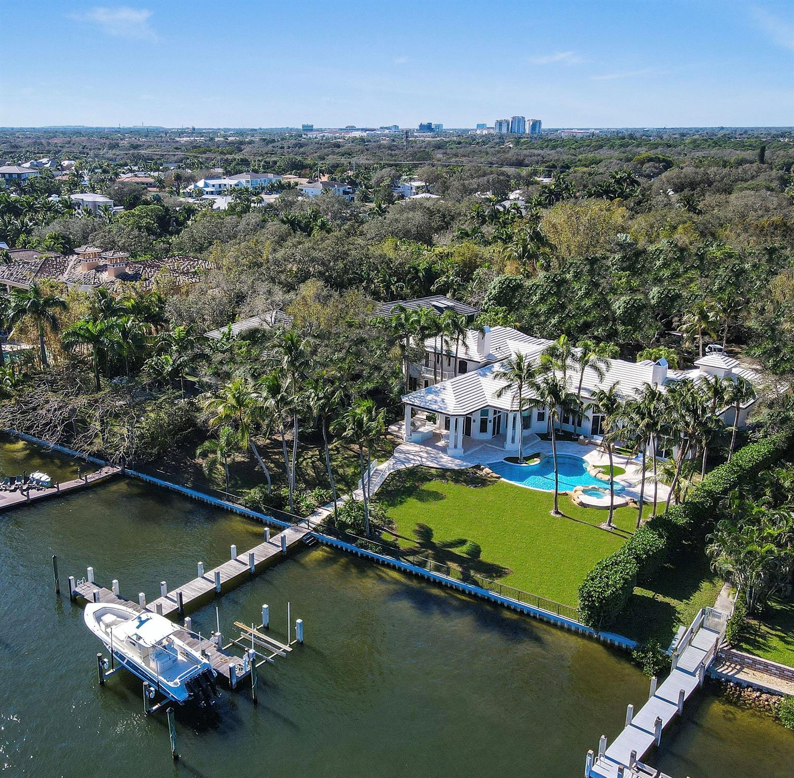 A truly unique opportunity awaits with this exceptional piece of direct intracoastal real estate in the heart of Palm Beach Gardens. Set on an elevated 1.04-acre lot, this expansive, privately gated estate has recently undergone a comprehensive renovation, designed from top to bottom by renowned interior designer Caitlin Kah Interiors, giving it a fresh, new construction feel. Surrounded by meticulously maintained mature oak trees, this remarkable waterfront retreat offers lush green views and optimal eastern exposure for a refreshing breeze. With an extremely rare 180 feet of deep-water intracoastal frontage, the property provides expansive direct intracoastal access. Fully fenced and gated with oversized back and front yards with sufficient space to add tennis/pickleball court or other expansion opportunities.

Inside, you'll find new white oak wood floors, custom cabinetry, expertly crafted lighting, wallpaper, window treatments, and finishes. The state-of-the-art chef's kitchen features top-of-the-line Wolf, Subzero, and Miele appliances, while 25-foot soaring ceilings enhance the elegance, comfort, and luxury of 2270 Wilsee Rd.

The resort-style backyard boasts a pool and spa, turf grass, coconut palms, a summer kitchen, and outdoor living spaces with stylish cypress ceilings, creating a spacious and inviting atmosphere rarely found in direct intracoastal living. Additional highlights include a brand-new roof, full home automation with a Control4 system, a 4-car garage, new floors, updated bathrooms and kitchen, impact windows, copper gutters, and more.