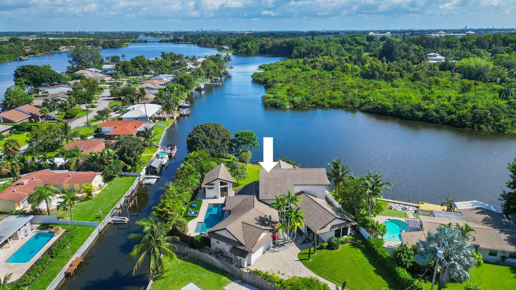 Stunning Waterfront Retreat on Lake Osborne!A luxurious single-family home nestled on a serene cul-de-sac in Lake Worth, FL. This newly remodeled masterpiece offers the perfect blend of elegance and tranquility with 310 feet of pristine waterfront on Lake Osborne.This exceptional property boasts 4 spacious bedrooms, each designed for comfort and privacy, complemented by 4.5 modern bathrooms. The generously sized primary suite features breathtaking lake views, creating a serene escape within your own home.An additional highlight is the charming 1-bedroom, 1-bathroom guest house, ideal for visitors or as a private retreat. The expansive eat-in kitchen is a culinary enthusiast's dream, equipped with high-end appliances and ample space for family gatherings.Step outside to discover