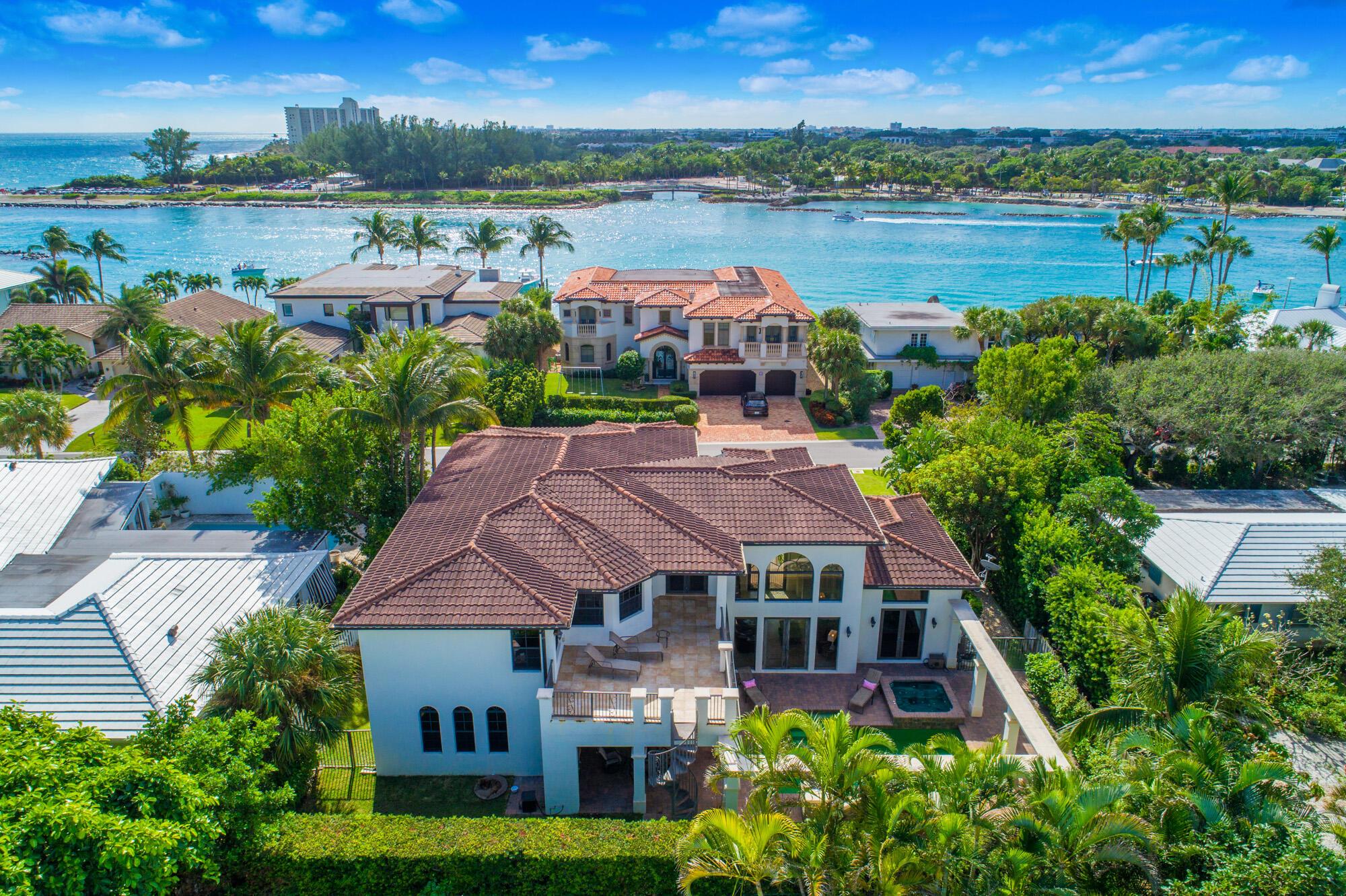 Don't miss your chance to own this remarkable home in Jupiter's most desirable community, Jupiter Inlet Colony. Experience coastal elegance in this expansive Mediterranean-style home, just steps from the private Beach Club and Jupiter Inlet & the gorgeous turquoise ocean waters! Custom built in 2007, this magnificent 5 BD/5.5 BA concrete home with impact windows & doors was impeccably constructed with the finest design, craftsmanship, and functionality in mind. Enter this elegantly designed home and marvel at the abundance of natural light, arched windows, trey ceilings, marble and hardwood floors, and custom woodwork. The gourmet kitchen features top-of-the-line stainless steel appliances, including a commercial-grade 8-burner gas stove and custom wood cabinetry... The master suite features a sitting area and a balcony with inlet and Intracoastal views. A first-floor mother-in-law suite offers a kitchenette and private entrance. Two other spacious guest bedrooms are located off the loft with walk-in closets and ensuite baths. The resort-style backyard includes a heated pool, spa, summer kitchen, covered patio, second floor sun deck, and lush landscaping. Oversized 3-car garage.
Located in an exclusive community with private beach access and 24/7 security, this home is perfectly positioned near beaches, marinas, and golf courses. Don't miss out on this exceptional opportunity.