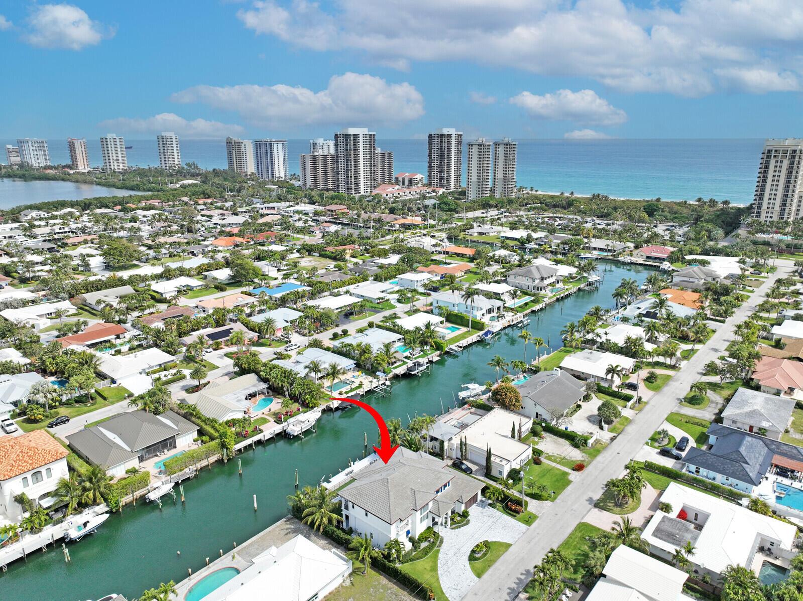 Step into a world of luxury with this stunning waterfront home, built in 2019 and situated on a spacious .25-acre intracoastal lot. Boasting 100 feet of prime waterfrontage, this property is a dream come true for boating enthusiasts, offering deep water and a wide channel to accommodate up to an 80-foot yacht. Located on the prestigious Bimini Lane, residents enjoy deeded beach access, enhancing the coastal living experience. Enter through grand, oversized doors into an open floor plan that exudes elegance. The expansive living space, over 4,200 sq ft under air and more than 6,000 sq ft in total, features breathtaking water views visible from rear sliding glass doors that open to a pool and vanishing edge spa. This five-bedroom, five-and-a-half-bath home is designed for comfort & style. With the first floor hosting a luxurious bedroom suite, formal dining area, laundry room, powder bath, and a private cabana suite/In-laws quarters complete with a separate entrance.

The second floor, accessible via a private elevator or staircase, offers a gorgeous master suite, two additional guest suites with private baths, an office/den with a Murphy bed, a wet bar area, and a covered lanai. Outdoor living is equally impressive, with an outdoor kitchen, natural gas grill, and a large pergola perfect for enjoying ocean breezes. The dock is fully equipped with electricity, water, a fish cleaning station, and a 10,000 lb boat lift, making it ideal for any boating adventure.

Additional features include a full-house 80kw Generac Quiet Source generator, high-end plumbing and electrical fixtures, a Sub-Zero appliance package in the kitchen, and a Trane A/C unit in the garage, perfect for a home gym. Security is paramount with a comprehensive system including cameras inside and out. The backyard is a true oasis, with a spiral staircase connecting the upstairs balcony to the pool area, artificial grass, professional landscaping, and a full-house water purification system.

Located on the coveted Singer Island, this property is more than just a home&#x14;it's a personal sanctuary where award-winning craftsmanship meets unparalleled coastal living. Paradise is calling!