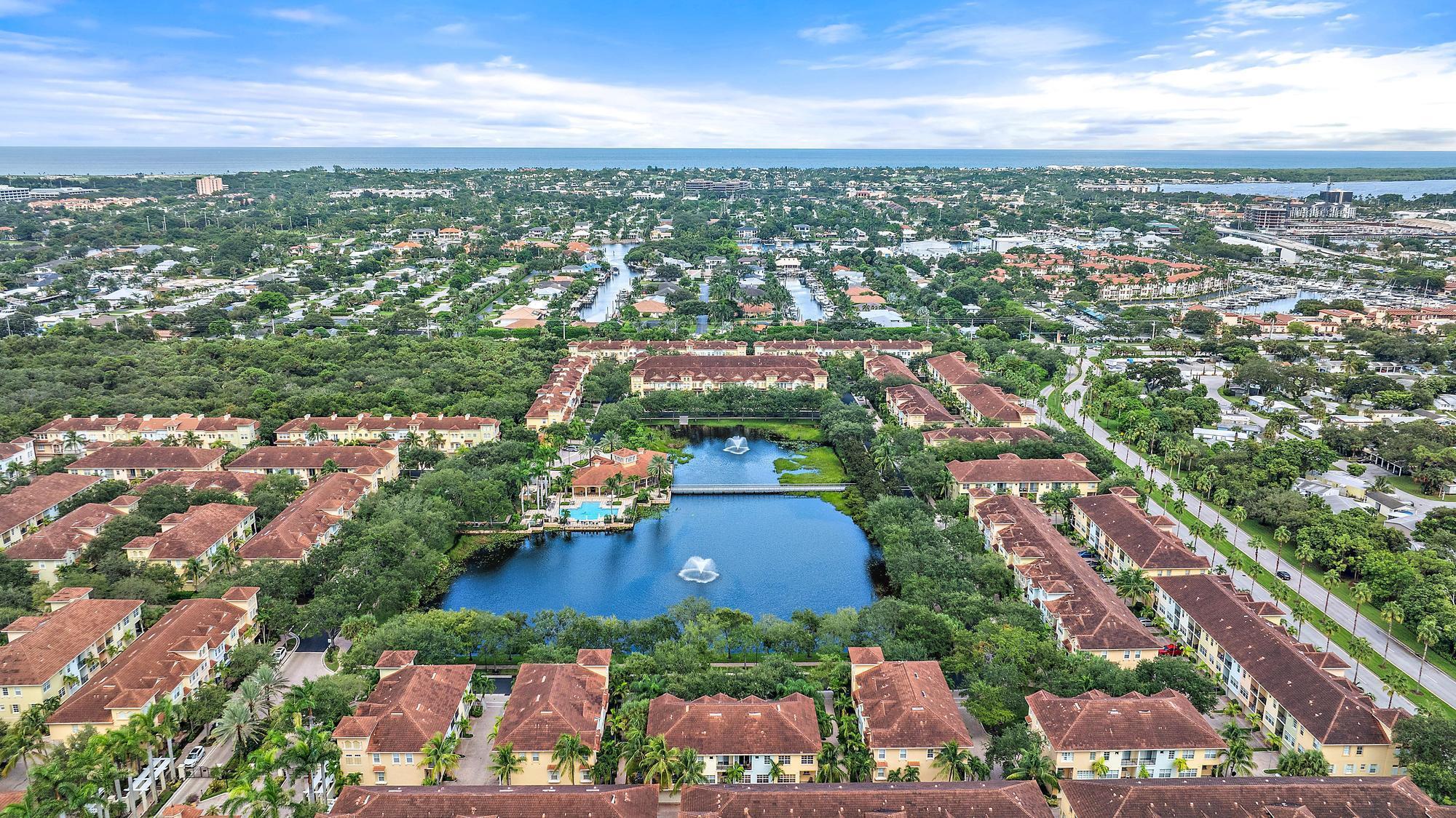 Incredible opportunity to own this meticulous townhome in the heart of Harbour Oaks. This unit is located on the inside of the neighborhood, which eliminates the public from accessing your unit from Gardens Parkway or Valencia Gardens Ave. In addition to this unit being extremely well kept and appointed, this unit features impact windows and doors throughout! A very rare occurrence in Harbour Oaks. The unit features 2 bedrooms (each with its own ensuite), plus Den, 3.5 Bathrooms, and an open living and dining area. Walking distance to the Gardens Mall, Lifetime Fitness, WholeFoods, etc. Roughly 1.2 miles from the I-95 entrance/exit. This unit truly is turn key! With a premium location and view, this is not one to miss.