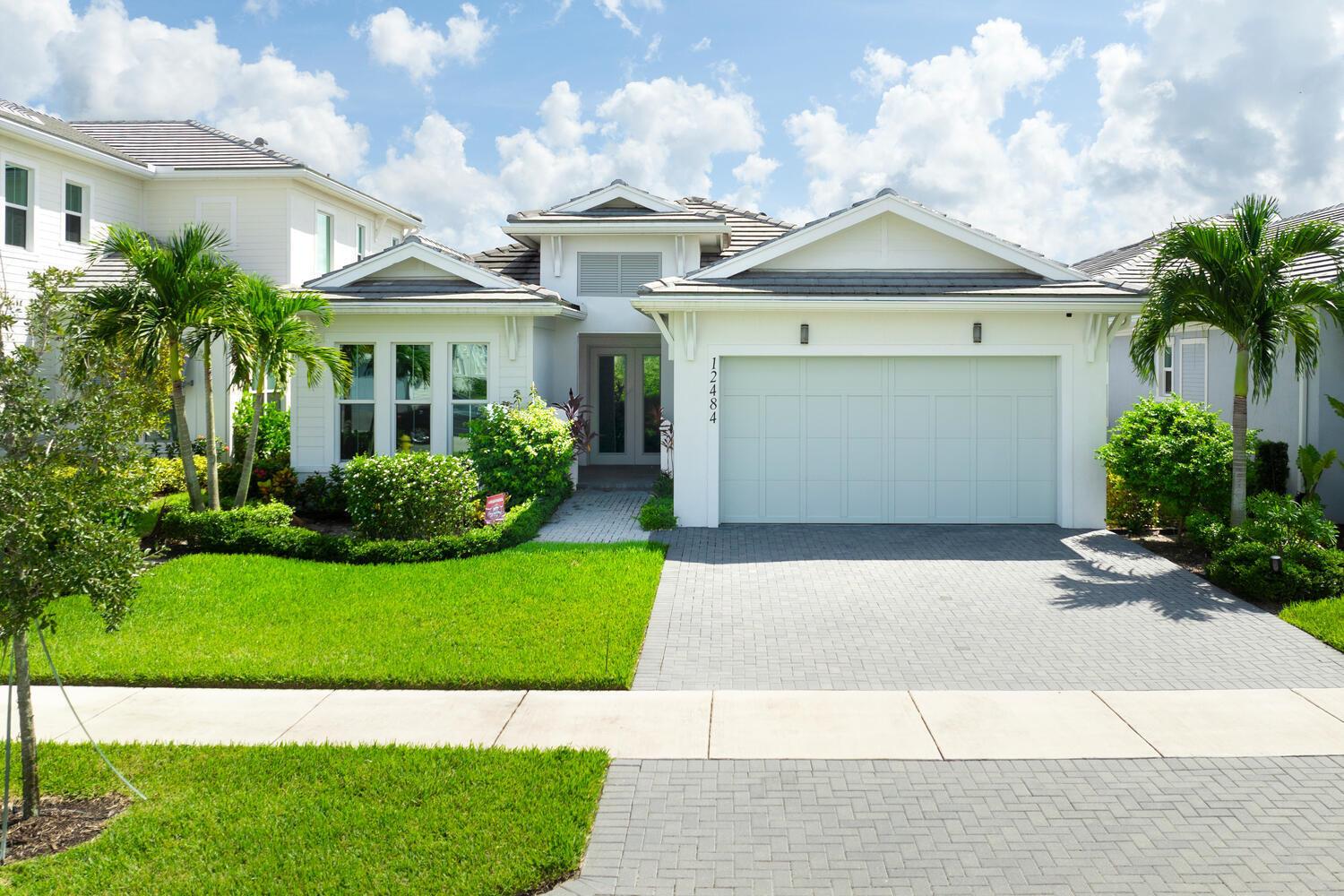 Built on one of the original premium lots in Windgate @ Avenir. This gorgeous waterfront home was built in 2021 with all the new construction kinks worked out, plus significant custom and builder upgrades. Brand new roof and impact windows in 2025.  The home is being offered turn-key fully furnished. No detail has been left untouched. As you enter the home, you will immediately notice the custom high end light fixtures throughout and wood plank porcelain tile flooring. The gorgeous kitchen has a huge center island covered with top of the line quartz paired with SS appliances. The living area leads to a wonderful lanai and custom pool overlooking the lake and fountain. The main living area also has custom electric blinds and top of the line ceiling fans. The fully fenced backyard has artificial turf, pristine landscaping, and solar lighting. All 3 bedrooms and the den/office have been upgraded with large plank high end luxury vinyl plank flooring.  The primary bedroom has a his and her walk-in closet and separate access to the outdoor lanai and pool deck.  Relax in your primary bath with separate his and her vanities, upgraded quartz counter tops, a free standing soaking tub, and separate shower with floor to ceiling tile. Additional upgrades include an entire house "watersoft" filtration system, Tesla (or other electric car) charger in the garage, and full cabinets and wash sink in the laundry.  
The new town center at Avenir has begun construction and full build out is years ahead of schedule.  A new Palm Beach Gardens fire/ems station and police station are also due to open in early 2025.  Come check out the premiere western community of northern Palm Beach County with amazing amenities, low HOA, and public golf course all at your finger tips.