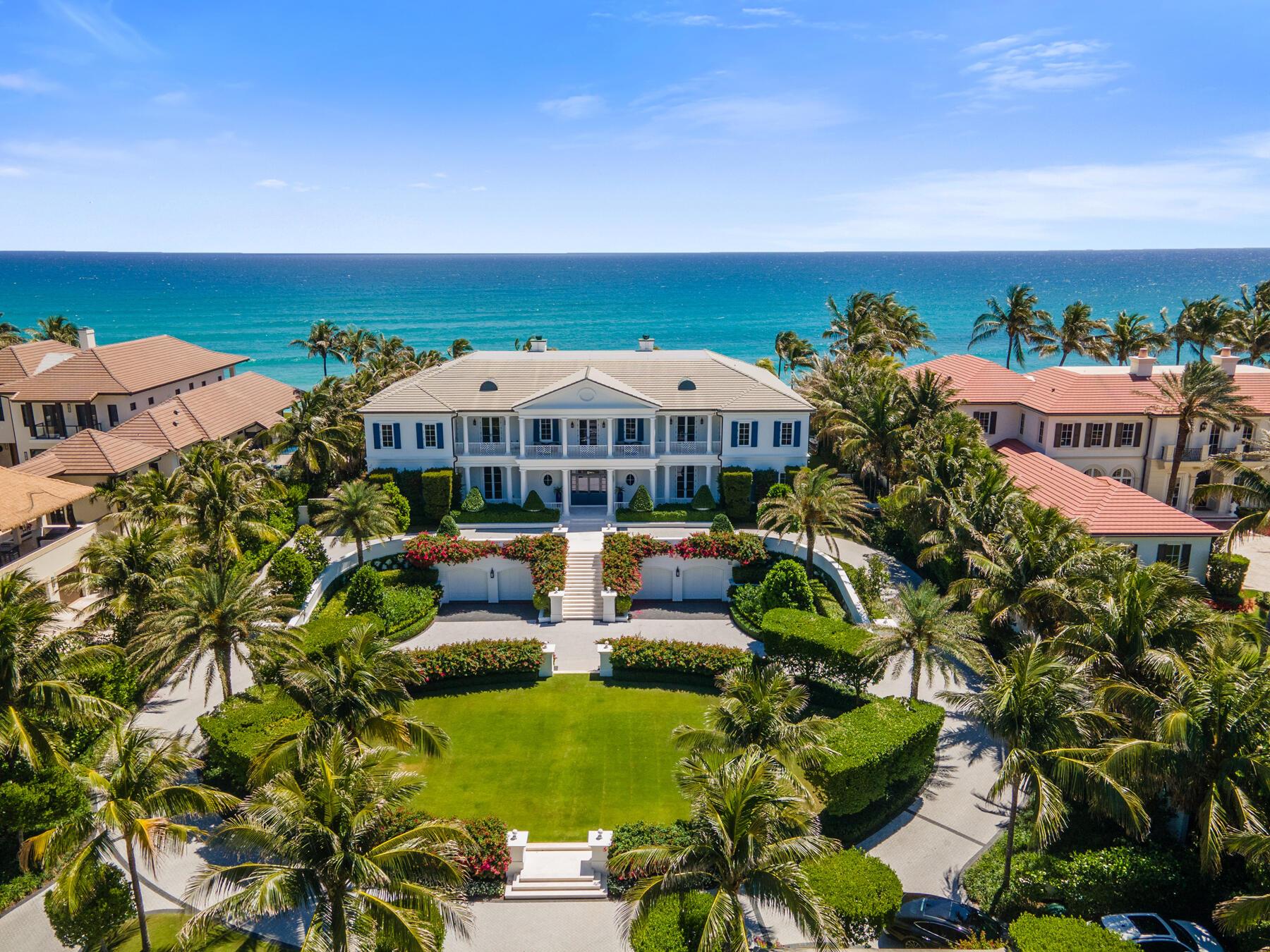 This ocean to lake coastal property is unlike any other, where 150 feet of ocean frontage meets the elegance of new construction completed in 2020. Immediately upon entering, you're drawn to the eastern facing waterviews in the living room filled with sunshine. This home offers several well-appointed bedrooms and baths designed to offer space, comfort and privacy. Additionally you will find a temperature controlled wine room, his & her powder rooms, gym and spa room and a most inviting bar and lounge. Outside, discover several thoughtfully landscaped gardens, verandas and a summer kitchen perfect for enjoying ocean breezes or head over to the intracoastal for sunsets on the dock which houses two lifts. This oceanfront compound includes two additional structures beyond the main residence; a surveillance and guard house for enhanced security and state-of-the-art stainless steel chef's kitchen, and a charming guest house. This property presents a rare opportunity to indulge in everything that represents coastal living.