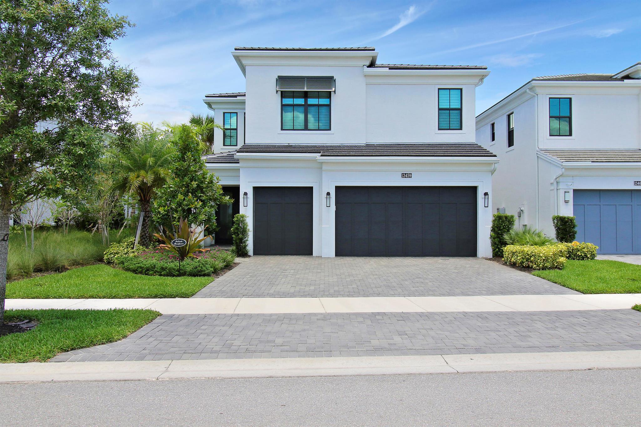 This 5 bedroom, 4 bath, 3 car garage with the deepest lot in the neighborhood is an exceptional residence nestled in the heart of Palm Beach Gardens. The home is a meticulously maintained property that offers the perfect blend of elegance, comfort, and modern convenience. This striking home showcases sophisticated design elements with a contemporary flair. From the entrance to the exquisite details throughout, every corner of this property exudes luxury. Step into an expansive open floor plan that effortlessly connects the living, dining, and kitchen areas. High ceilings, elegant crown molding, and large windows create a light-filled, airy ambiance perfect for both everyday living and entertaining. The chef's kitchen is a dream come true, featuring top-of-the-line stainless steel appliances, custom cabinetry, a large center island with seating, and beautiful granite countertops. Whether you're preparing a quick meal or hosting a grand dinner party, this kitchen is sure to impress. The serene master suite offers a private retreat with a large walk-in closet and a spa-like en-suite bathroom. Enjoy the tranquility of a soaking tub, a separate glass-enclosed shower, and dual vanities. Four additional bedrooms provide ample space for family and guests, each with its own unique charm and access to well-appointed bathrooms. Step outside to your personal paradise. The expansive covered lanai overlooks a sparkling pool and spacious backyard. Whether you're lounging in the sun or dining al fresco, this outdoor space is designed for ultimate relaxation and enjoyment. Located in the prestigious Artistry community with access to amenities such as a clubhouse, fitness center, tennis courts, and walking trails, you'll have everything you need right at your fingertips. Enjoy the best of Palm Beach Gardens with proximity to top-rated schools, fine dining, upscale shopping, and beautiful beaches. With easy access to major highways, commuting is a breeze. This exceptional home offers unparalleled luxury and a lifestyle of convenience and comfort.