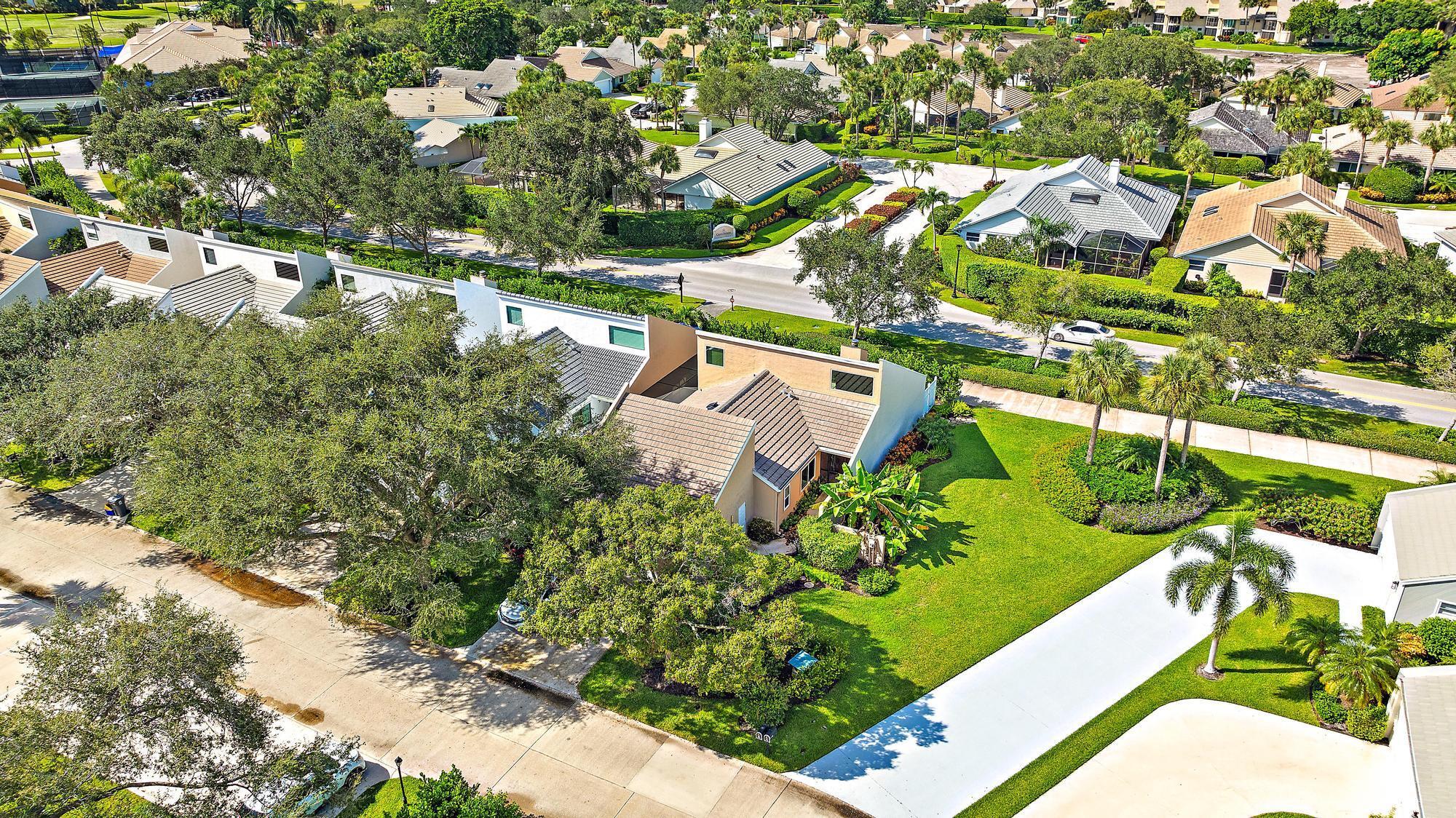 Welcome to Greens Cay, located in the highly sought-after gated community of Jonathan's Landing. This charming home features two bedrooms, two bathrooms, plus a versatile den, impact windows and a new slate roof (2020) Enjoy two outdoor patios, one of which is screened for added comfort. The neighborhood boasts a stunning pool and is within walking distance to the clubhouse, as well as tennis and pickleball courts. Experience living in the heart of Jupiter, just moments from shopping, dining, and the beautiful beaches.