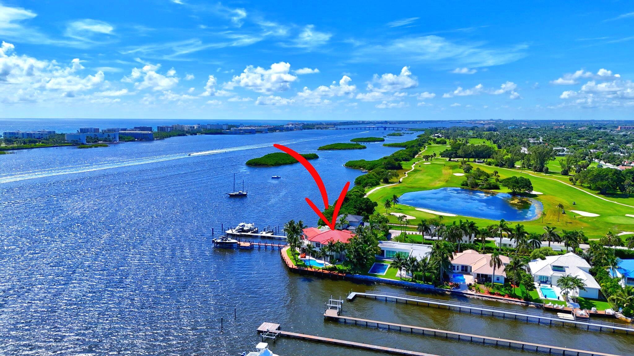 This Intracoastal estate offers an unparalleled blend of luxury, privacy, and convenience, set against the backdrop of breathtaking Intracoastal and Palm Beach Island views. Located in an exclusive gated enclave of 7 homes ensuring ultimate privacy and tranquility. 210' of direct intracoastal frontage, with a 210 ft. dock and two deep-water boat slips accommodating vessels up to 50 - 60ft. without obstructing views. Potential to expand private dock to accommodate an even larger yacht. Includes a boat lift and separate lift for jet skis. Northeast-facing in back with sweeping Intracoastal vistas, stunning sunrises, and refreshing breezes for perfect outdoor entertaining and relaxation.  Impressive living areas with soaring ceilings and impact windows that fill the home with natural light. Gourmet kitchen featuring an oversized island, custom cabinetry with intricate molding, and top-of-the-line appliances.  6 bedrooms and 5 bathrooms, including master suites on both the ground and upper floors. The master suite boasts double walk-in closets, a luxurious bathroom, an expansive wrap-around balcony, and a spiral stairwell leading to the patio, pool, and spa.  Additional Features: 3 car garage, Elevator, Brand new composite 210' dock, whole-house gas generator, 4 new A/C units, newly resurfaced pool w/updated equipment, marble floors throughout, Crestron System for audio lighting and climate control, Hunter Douglas custom blinds, furniture negotiable.  Close to world-class dining and shopping on Palm Beach Island and Worth Ave.  Lake Worth Beach Golf Club steps from property and The Park West Palm (PGA style course-5 minute drive). 10 minutes to downtown West Palm Beach, Rosemary Square, Clematis Street and PBI Airport.  Schedule a showing today to experience the serenity and sophistication of this unparalleled estate.