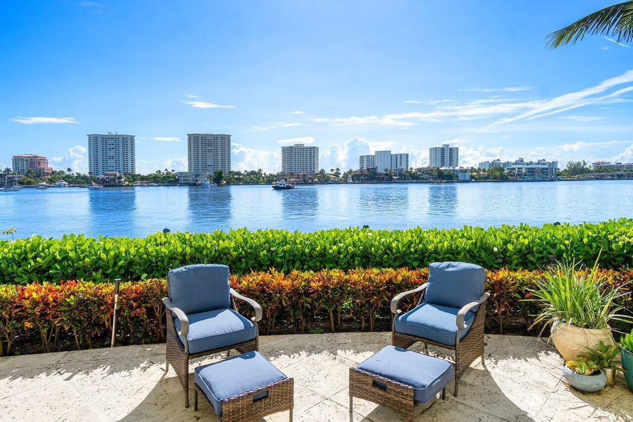 Brand New to Market! Highly Coveted Center Stack - Residence 102N - in the Acclaimed Full-Service Mizner Grand Condominium Sited on the Grounds of the Boca Raton, a World-Class Resort. Offering Direct, Unobstructed Views of Lake Boca, Residence 102N Spans Over 4,200 sq/ft. Featuring 3-Bdrms en-suite + Den, High Ceilings, a Private Lakefront Yard w/ Direct Walk-Out Access to Lake Boca for Optimal Outdoor Entertaining.  Enjoy a Gourmet Kitchen w/ Stunning Panoramic Views of Lake Boca and a Lavish Primary Suite Boasts a Walk-In Dressing Room/Closet & 2 Primary Baths. This Unique Lanai Offering in Mizner Grand Presents the Seclusion of a Single-Family Estate w/ the Convenience & Security of Luxury Condominium.  ALL Assessments Paid in FULL by Seller! Mizner Grand has been completely reimagined with state-of-the-art design concepts, offering its residents a sophisticated living experience unlike any other. From the moment you arrive, you are greeted by the most professional and attentive staff in Boca Raton, providing unparalleled service, including on-site security and valet. Residents enjoy access to two exquisite pools overlooking the Intracoastal, modern fitness rooms, luxurious steam and sauna facilities, as well as elegant club and card rooms, all meticulously crafted for your ultimate comfort and indulgence.