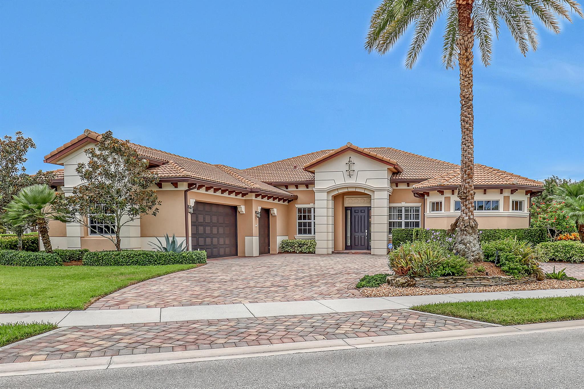 Introducing the stunning lakefront Stockton model, perfectly located in Rialto, one of Jupiter's most coveted gated communities. You will love the luxury plank flooring in this four-bedroom + office, three-bathroom single-story home exudes modern elegance. Featuring solid CBS construction, impact windows, and countless upgrades--including solar panels and breathtaking lake views--this home sits on an expansive, over half-acre double corner lot. As you arrive at 104 Manor Circle, you'll be captivated by the sprawling circular brick paver driveway and the beautifully landscaped exterior, setting the tone for the elegance that awaits inside.Furniture is negotiable.