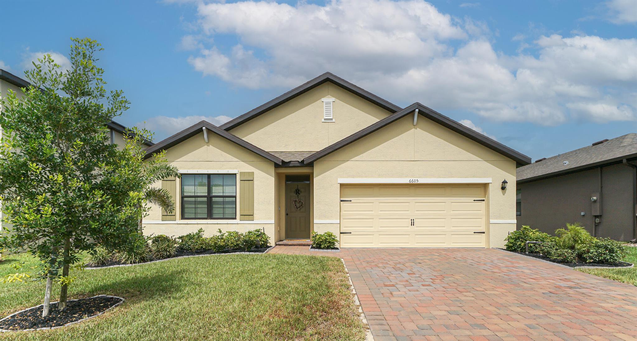 Welcome to your slice of paradise! This 2022 newer build single story home with 4 Bedrooms and 2 bathrooms, offers the perfect blend of style, comfort, and tranquility, located in a serene gated community of Lost tree preserve in Vero Beach.  As you step inside, you'll be greeted by an airy, open-concept layout perfect for entertaining. The spacious great room area features a modern kitchen featuring granite countertops, and white shaker style cabinets with black hardware accents. The primary suite includes a very spacious shower and a generous walk-in closet. The additional 4th bedroom offers flexibility for guests, a home office, or even a hobby space. Fully fenced for privacy, it overlooks a preserve with no neighbors behind but yet close to the community pool and pickleball courts.