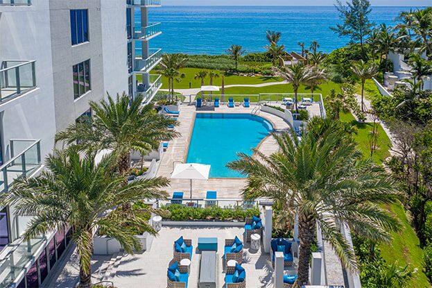 Have you ever dreamed of having an oceanfront home without the maintenance and upkeep? This residence offers just that:Providing the expansive feel of a single-family home with the ease and convenience of luxury condo living, this is the ultimate luxury beach house without the hassle! Enjoy idyllic Florida beachside living in this first-floor walk-out residence, nestled directly on the dunes at Singer Island's premier address, 5000 North Ocean.This one-of-a-kind Sandcastle residence has grandeur of a single-family home, boasting 12-foot ceilings, floor-to-ceiling windows and expansive living spaces. Live like you are on vacation in nearly 4,000 square feet of sophisticated interiors and an additional 3,000 square feet of private outdoor space, including a raised gazebo, outdoor kitchen, outdoor shower and sundeck- overlooking the Atlantic.

Truly no stone has been left unturned in the custom design and upgraded finishes offered in this unique space. The open floor plan features 4 bedrooms, 5 bathrooms, and a gourmet kitchen with European cabinetry, waterfall quartz countertops and high-end WOLF appliances. The primary suite is a serene retreat with two spa-like bathrooms and ocean views, dual walk-in closets and an additional space for a home gym, office or nursery. Additional guest suites are conveniently spaced to maximize privacy and comfort with 2 en-suite spaces and one oversized room with French doors which could double as an office or flex room.  

The esteemed 5000 North Ocean, built in 2020, offers just 48 private residences across 4.5 acres of pristine natural habitat and coastline, with 340 feet of private beachfront. Residents enjoy concierge services, a Club Room, fitness center, and an oceanfront pool. Nestled on Singer Island's tranquil north end, this residence offers direct access to miles of beaches and outdoor activities as well as upscale dining and
shopping, making every day feel like a dream vacation.