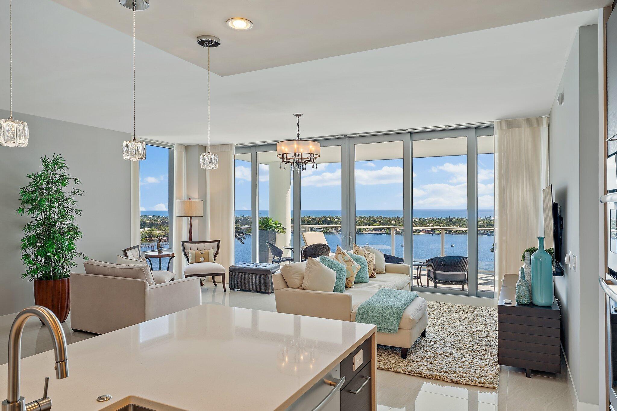 Enjoy amazing views to the ocean, Lake Worth Lagoon, and as far as they eye can see from this ultra luxury ''Azure'' floor plan in Water Club. The Azure model is the largest floor plan of the four regular stacks in the first two towers of the community. This unit also has a den/office that could serve as bedroom # 4 because it has a full bath and sleeper sofa. Best of all, Water Club has world class amenities like 24/7 manned and gated security, private elevator lobbies, covered parking, a private clubhouse, resort style pool, lap pool, fitness center with yoga/pilates studio, spa, fire pits, pickle ball court, guest suites, and more..