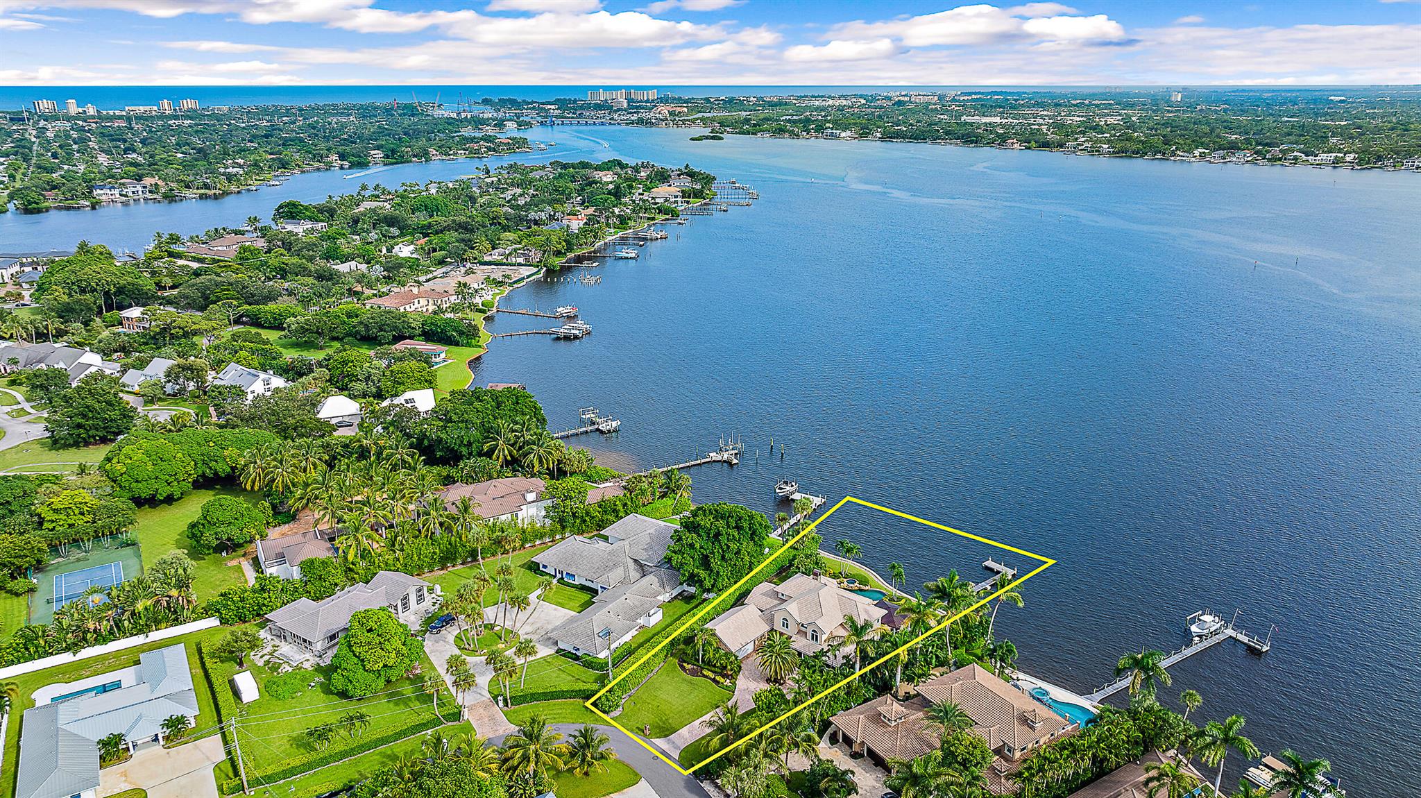 Located in Tequesta Country Club, on an oversized lot, this stunning two-story waterfront home sits on nearly half an acre with 138' of wide waterfrontage. The southern exposure offers breathtaking views with incredible sunrises and sunsets.  With 4,845 sqft under air, the home features 5 bedrooms, 3.5 bathrooms, a large versatile bonus room, a house generator, a heated infiniti pool and spa, a tranquil outdoor covered sitting patio, lots of storage and a 2-car garage with bonus workshop.  Recent upgrades include, but not limited to, 3 AC units, 2 hot water heaters, new pool equipment, newly constructed outdoor sitting patio with retractable hurricane rated screens and a beautifully redone dock with Brazilian wood. Don't miss this one-of-a-kind opportunity!