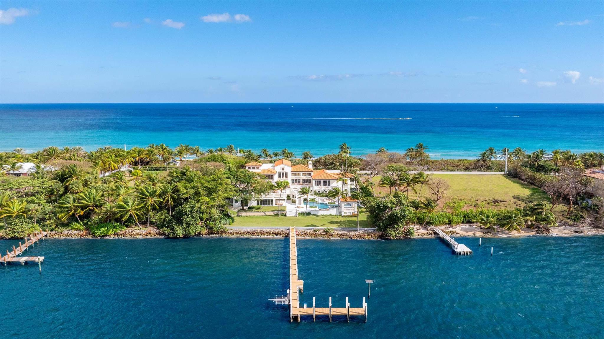 Recently updated, this stunning Ocean-to-Intracoastal Manalapan compound with beach house is situated on almost two acres with 150 feet of direct ocean and Intracoastal Waterway frontage. Boasting over 19,600 total square feet, the residence offers scenic ocean and Intracoastal views throughout and eight total bedrooms including a luxurious primary wing. Many upgrades include new flooring; all new bathrooms; new impact sliders; and new cooler unit in wine room. Multi-level terraces and balconies provide ample room for outdoor living and dining. The manicured grounds include resort-style pool with spa; new landscape; and sprawling lawn that overlooks 150 feet of Intracoastal waterfrontage. Boaters will appreciate the large dock and new seawall plus easy ocean access via nearby inlets. FEATURES:
Located in Manalapan, Florida
Ocean-to-Intracoastal Compound situated on 1.85 acres
150 feet of direct ocean frontage with beach house
150 feet of direct Intracoastal Waterway frontage with large dock and new seawall
8 total bedrooms / 7 full and 1 half baths
11,953 square feet under air / 19,606 total square feet
Decorative drive and porte cochere entryway
Spacious living room with fireplace; volume ceilings; and walls of windows and sliders for water views of the ocean and Intracoastal
Formal Dining room with easy access to kitchen and wine room
Large, open kitchen with two islands; lots of cabinets; breakfast area; and access to the outdoor dining area
Casual living room with bar and walls of windows sliders overlooking the grounds and Intracoastal
Beautiful winding staircases and elevator
Private office and additional sitting areas
First floor luxurious primary wing with sitting area; ocean and Intracoastal views; walk-in closets; and expansive bath with two showers, roman tub, and two water closets.
Multi-level terraces with wide water views and ample space for outdoor dining and living areas
Rooftop observation terrace with indoor wet bar
Resort style heated pool with spa overlooking the Intracoastal Waterway
Tranquil green spaces; large open lawn; and manicured landscape
New seawall and large dock with ocean access via nearby inlets
Private beach house with living area; bedroom and bathroom; seaside deck; and path through dune to the beach
Recent updates include new cooler in wine room; 5 new ac units; new impact sliders throughout; remainder of windows replaced with impact glass; power shutters in place; Control4 system installed for main areas and primary wing (can be expanded); all bathrooms remodeled; primary bath extended to allow for two showers and separate water closets; new flooring in several areas; new seawall on Intracoastal Waterway to allow for a graded green space; new landscaping; new pavers; new skylights; and refinished pool with new water line tile
Ideally located between Palm Beach and Delray Beach; enjoyable drive along A1A for shopping and dining enjoyment.