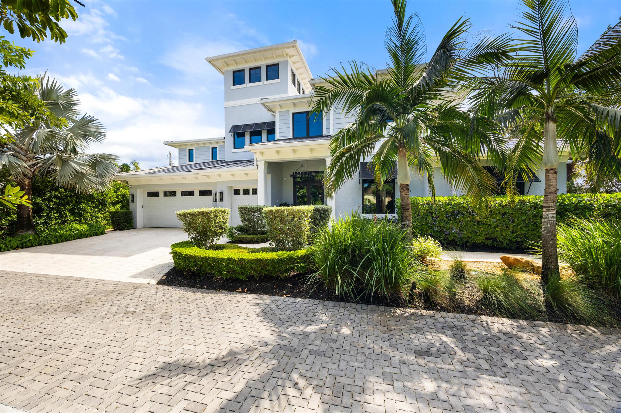 Your dream has come true in Juno Beach. This 2018-built custom home offers rare, private, deeded beach access. East of Juno's Beach Road, this lot is over 1/4 acre, and owners enjoy an extremely short walk to what feels like a private beach. Such close proximity to the Atlantic affords this home calming ocean views from multiple rooms. Thoughtfully laid out on two floors, 272 Celestial Way provides a ground floor owner's suite, 5 total bedrooms, 5 full bathrooms, 2 offices, and an upstairs living area. Your new kitchen, renovated in 2024, includes a large island, custom cabinets, gas range and cooktop, wine cooler, and a mixture of Bosch, Wolf, and Sub-Zero appliances. No expense was spared, and no detail was overlooked when selecting finishes. 2024 office and bathroom renovations. Large garage will hold 2.5 cars and has built-in storage, an epoxy floor, and a Tesla charger. An effective hurricane shelter, this CBS home is equipped with a large generator and full hurricane impact windows and doors. Often overlooked, yet valuable features include natural gas service, full home security system with cameras, wired-in sound system, fireplace, lightning grounding system, first and second-floor laundry, solid-core doors, and 3-zone A/C system. Juno Beach is ranked as one of Florida's safest towns. Surrounded by upscale restaurants, shopping, and golf courses, this location has become among the most popular in the country.