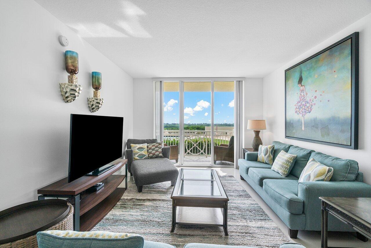 Escape to your perfect getaway in this spacious 2-bedroom, 2-bathroom condo, just steps away from the intracoastal , less than 1 mile walk to the beach .  This beautifully furnished unit offers an open floor plan, modern kitchen, and private balcony with stunning views of the pool desk  Located in a community with resort-style amenities including a sparkling pool, hot tub, fitness center, club room, sauna and steam room , you'll have everything you need for a relaxing stay.Whether you're here for a seasonal retreat or an extended vacation, this condo provides the perfect combination of luxury and convenience. Enjoy easy access to shops, restaurants, and local attractions, all within walking distance. A short drive to Delray Beach Rent to make unforgettable memories