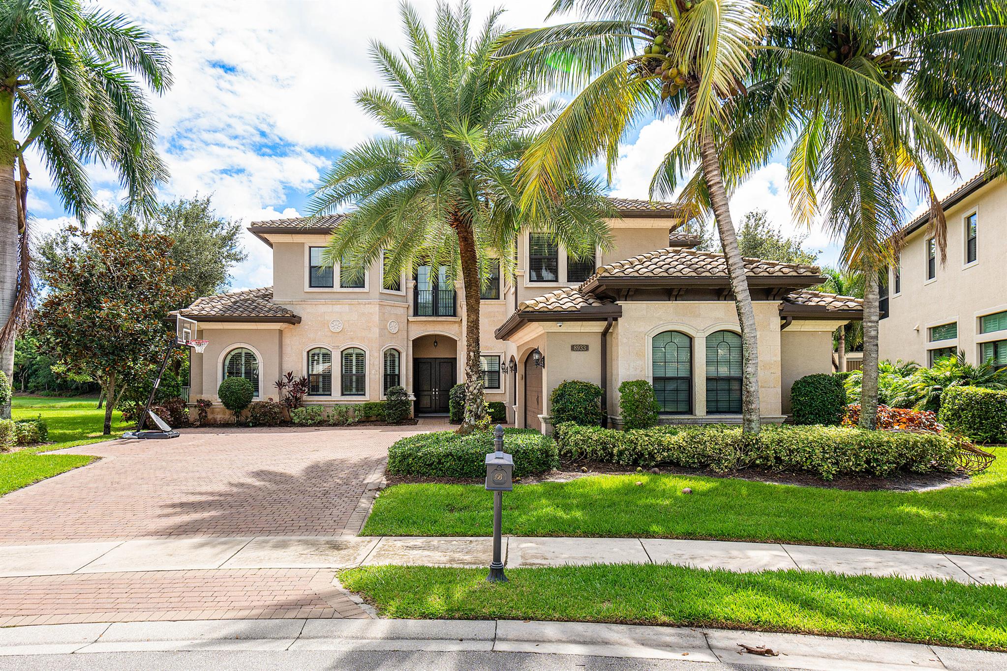 Discover luxurious living at 8933 Sydney Harbor Circle in The Bridges, Delray Beach! This stunning estate sits on an expansive almost half-acre lot in a quiet cul-de-sac, offering both privacy and grandeur. Designed for those who seek the finest, this home features soaring ceilings, open living spaces, and high-end finishes throughout. The gourmet kitchen is a chef's dream, perfect for entertaining. Outside, the resort-style pool and spacious patio invite endless relaxation. With top-tier community amenities including tennis, fitness center, and clubhouse, your dream lifestyle awaits! The Bridges is the ultimate resort lifestyle living for your family and friends. Ideally located in Boca/ Delray area. Its located close to shopping, dining, the beach, airports and A rated schools.