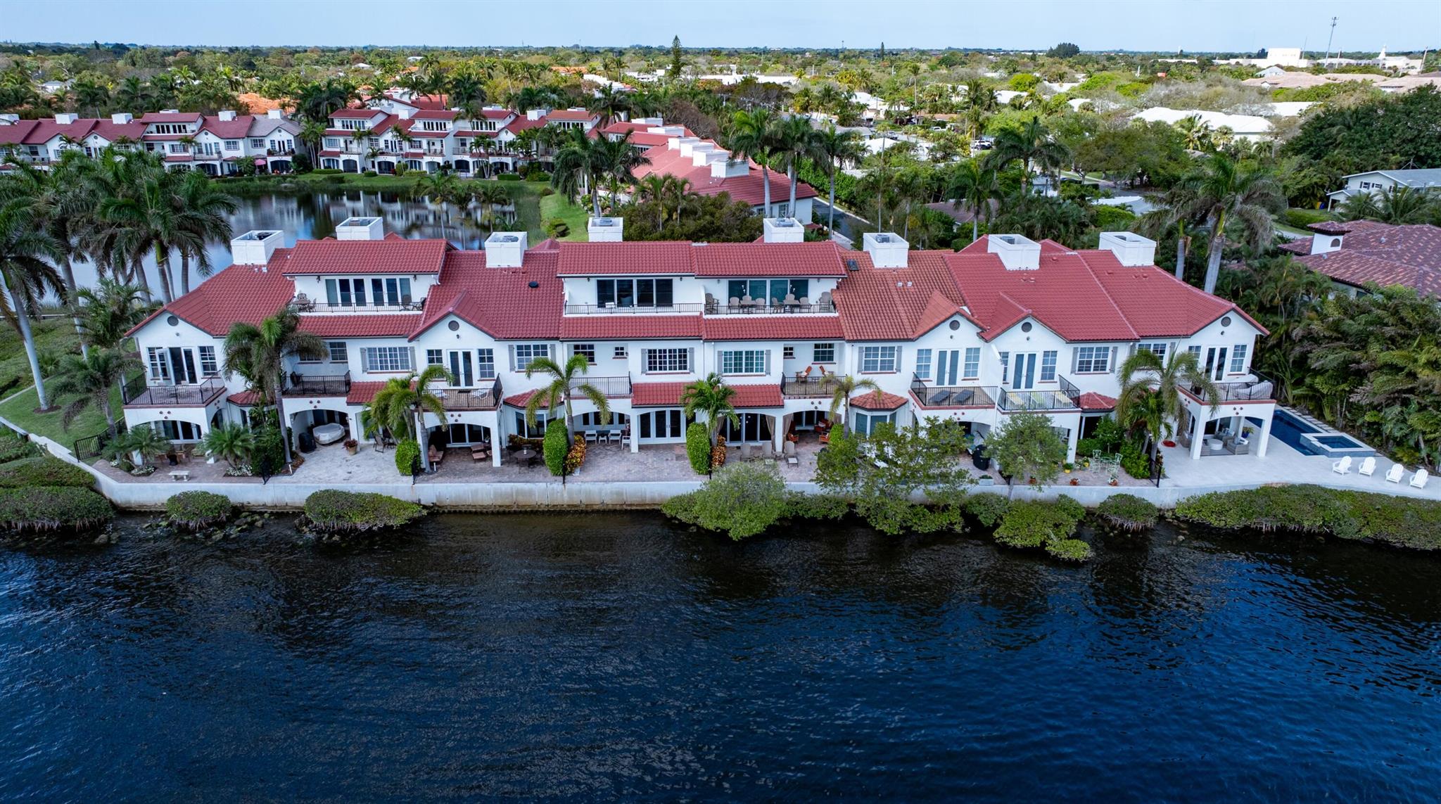 Minutes from Delray Beach's sugar-sand oceanfront and Downtown Atlantic Avenue's shopping and dining venues, The Estuary offers relaxed living in the timeless charm of this award-winning, 24-hour-guard-gated townhome community.  In a scenic setting on the Intracoastal Waterway, The Estuary features Mediterranean-inspired architecture, cobblestone walkways, and tranquil lakes. Completely renovated, including new systems and roof in 2021, this chic three-bedroom townhome at The Estuary, with a third-floor family room and bar, captures sweeping intracoastal and serene lake views. An open floorplan great room, with an adjoining chef's kitchen, accesses the water-view loggia and patio. The primary suite and the family room both open to private Intracoastal-view balconies. 1583 Estuary Trail, Delray Beach, Florida:  Minutes from Delray Beach's sugar-sand oceanfront and Downtown Atlantic Avenue's shopping and dining venues, The Estuary offers relaxed living in the timeless charm of this award-winning, 24-hour-guard-gated townhome community.  In a scenic setting on the Intracoastal Waterway, The Estuary features Mediterranean-inspired architecture, cobblestone walkways, and tranquil lakes. Residents enjoy a community pool, cabana, playground, and a newly updated pier that includes an adjacent white sandy beach perfect for launching kayaks. 

PROPERTY:  

Newly renovated and landscaped, the brick terrace and loggia offer alfresco living with the gorgeous waterway vista as its backdrop.

RESIDENCE:  

Enjoy beautiful sunrises and sunsets at this exceptional, three-story townhouse at The Estuary in Delray Beach! Upon entry, you are greeted by the gracious foyer that seamlessly flows into the extra-wide, open-concept, bright and airy living room, featuring beautiful, Italian-imported, white-porcelain tile floors and east-facing French doors that open to the loggia overlooking the Intercostal Waterway. The chef's kitchen, which effortlessly connects to the dining area, is a culinary enthusiast's dream. It showcases lacquered, custom-built cabinets adorned by a quartz countertop and backsplash that runs from the stove to the ceiling. Professional-grade appliances include a large Wolf induction cooktop, a built-in Wolf convection steam oven, a built-in Wolf convection oven, a Wolf microwave built into the quartz waterfall island, and a Cove dishwasher. The SubZero refrigerator is an exclamation point, and another chic feature is the large, white-ceramic farmer's sink. Upstairs, with two large doors at the entry insuring privacy, the primary bedroom accommodates a king-size bed and features a French door to the sunset balcony along with wall-to-wall windows that flood the room with natural light and offer Intracoastal views. The primary ensuite bathroom provides a tranquil retreat and accommodates a large, glass-enclosed shower; elegant, Italian, porcelain-tiled walls and floors;  a separate, deep soaking tub;  custom-built vanity with dual sinks; and adjoining private water closet with a Toto smart toilet. The suite also includes a walk-in closet with custom shelving. Additionally on the second floor are two lake-view guest bedrooms with large closets providing ample storage space. From the hallway, these bedrooms access a bathroom with a glass-enclosed, full-size shower. On the third floor, the family room, with an ensuite bathroom and a full-service bar, opens to breathtaking views of the Intracoastal-view from the sunset balcony that runs the full width of the townhome. Completing the floorplan are a powder room, elevator, a washroom that contains custom-built cabinetry and a full-size Maytag washer and dryer, and the two-car garage. Additional details of note: the stair risers and treads, as well as the second and third floors, are adorned with large-plank-oak floors, and the townhome contains central heating and cooling serviced by two separate units. 

DISCLAIMER: Information published or otherwise provided by the listing company and its representatives including but not limited to prices, measurements, square footages, lot sizes, calculations, statistics, and videos are deemed reliable but are not guaranteed and are subject to errors, omissions or changes without notice. All such information should be independently verified by any prospective purchaser or seller. Parties should perform their own due diligence to verify such information prior to a sale or listing. Listing company expressly disclaims any warranty or representation regarding such information. Prices published are either list price, sold price, and/or last asking price. The listing company participates in the Multiple Listing Service and IDX. The properties published as listed and sold are not necessarily exclusive to listing company and may be listed or have sold with other members of the Multiple Listing Service. Transactions where listing company represented both buyers and sellers are calculated as two sales. "No payments made until title passes" Some affiliations may not be applicable to certain geographic areas. If your property is currently listed with another broker, please disregard any solicitation for services. Information published or otherwise provided by seller, listing company or its representatives is deemed reliable but are not guaranteed and subject to errors, omissions, or changes without notice. Copyright 2024 by the listing company. All Rights Reserved.