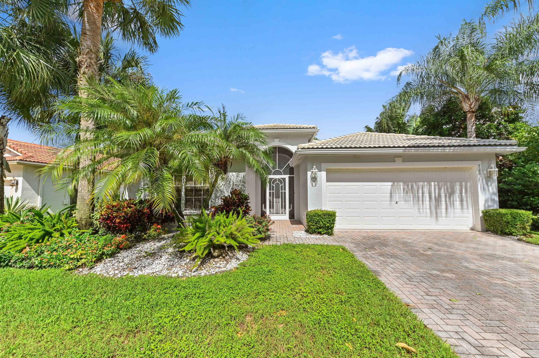 Introducing 7287 Wailea Ave, Boynton Beach--an elegant Coral model home in a tranquil lakefront setting, perfectly located away from the city's hustle but still easily accessible.Step inside through custom etched glass doors to be greeted by stunning lake views from the living room, dining room, family room, and kitchen. The Master suite, with bay windows overlooking the lake, offers a peaceful retreat. The home also features updated air conditioning (2023) for year-round comfort. Enjoy the outdoors on the spacious tiled patio, roofed and screened for relaxation or dining al fresco.With access to a resort-style 55+ clubhouse featuring pools, a fitness center, tennis and pickleball courts, and year-round activities, this home offers not only comfort but a vibrant lifestyle.