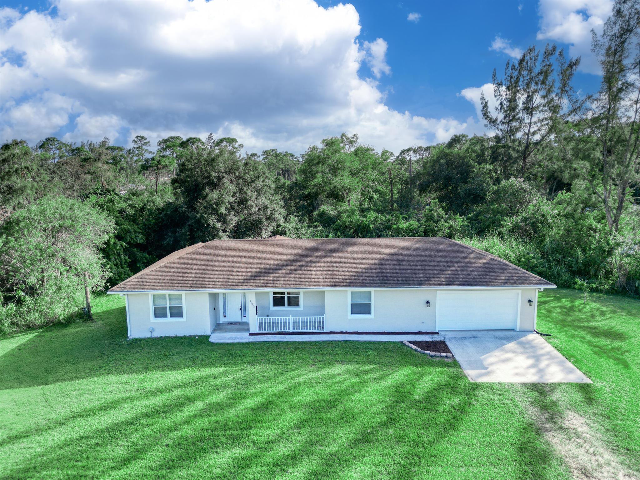 **Stunning 3-Bed, 3.5-Bath Home with Spacious Lot & Prime Location!**Welcome to this beautifully maintained 3-bedroom, 3.5-bath home, built in 2002, located conveniently near Okeechobee Blvd and Southern Blvd. Freshly painted and featuring thoughtful upgrades, this home is move-in ready!Each bedroom boasts its own private full bath, offering comfort and privacy for all. The spacious master suite includes a luxurious en suite bath, creating a perfect retreat. The open-concept living areas flow seamlessly, with plenty of natural light and space for entertaining.Situated on a huge lot, there's ample room for outdoor activities, future expansions, or landscaping dreams. Don't miss this opportunity!