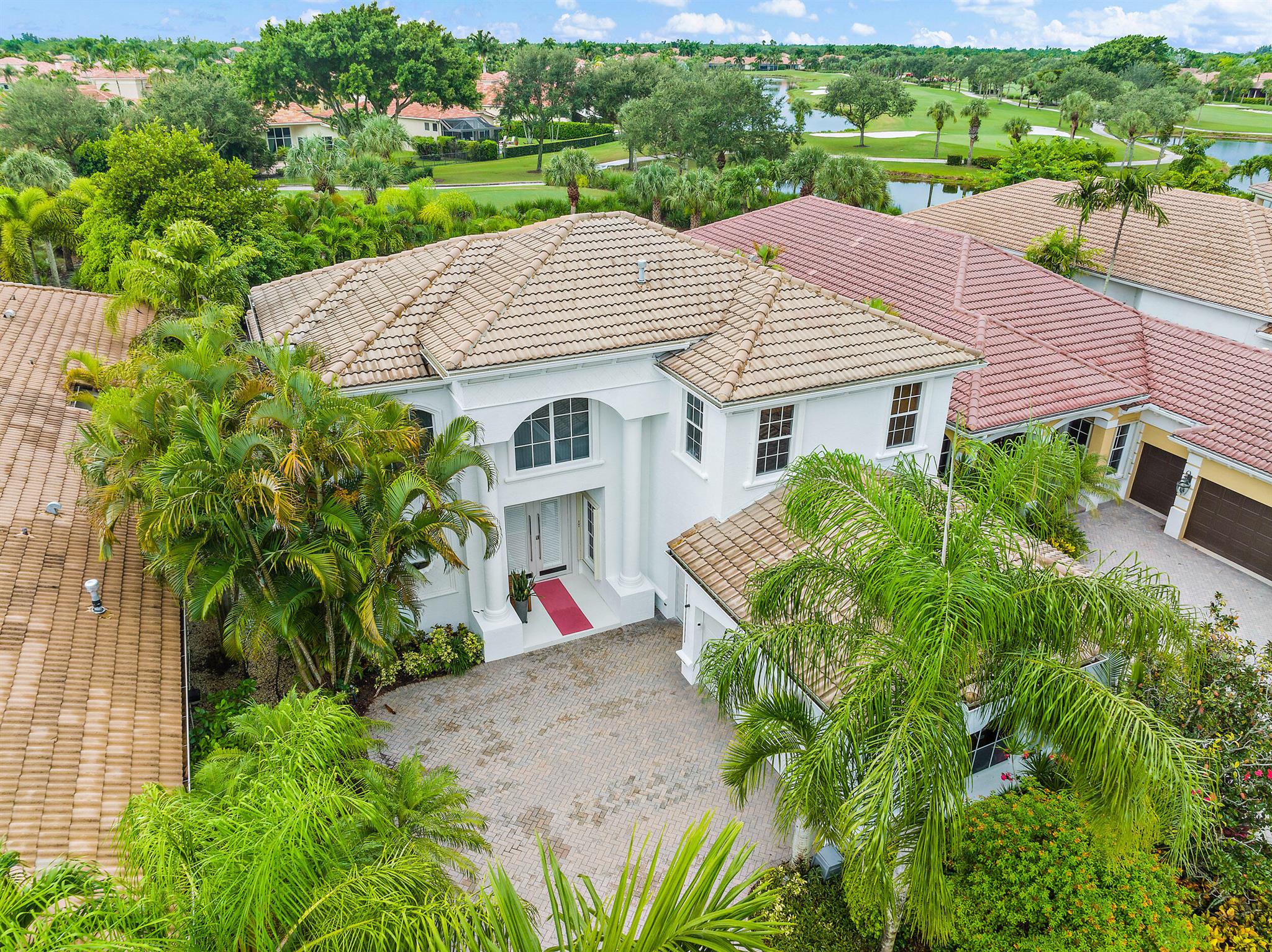 This 3500 SF Purucker-built home has been completely reimagined! Offering privacy and a bright southern exposure, this home features a spacious, upgraded pool and rock waterfall spa, with golf course views in the back. Beginning at the porch, dramatic 24x24 white tile is featured throughout the main living areas downstairs, providing a sleek and contemporary canvas. Cutting edge remodeled kitchen with upgraded appliances, and a remodeled master bath combined with avant gard light fixtures, designer window treatments, luxurious flooring, dramatic moldings, and custom touches throughout make this 3BR/4BA+Den+Loft a unique and choice in today's market. This home features a new smart AC and smart lighting throughout. Enjoy this remodeled, one-of-a-kind home within the resort-like setting of the award-winning club at Ibis. Ibis offers world-class amenities including 54 holes of Nicklaus golf, five restaurants, a state-of-the art tennis, fitness and spa complex, and much more.