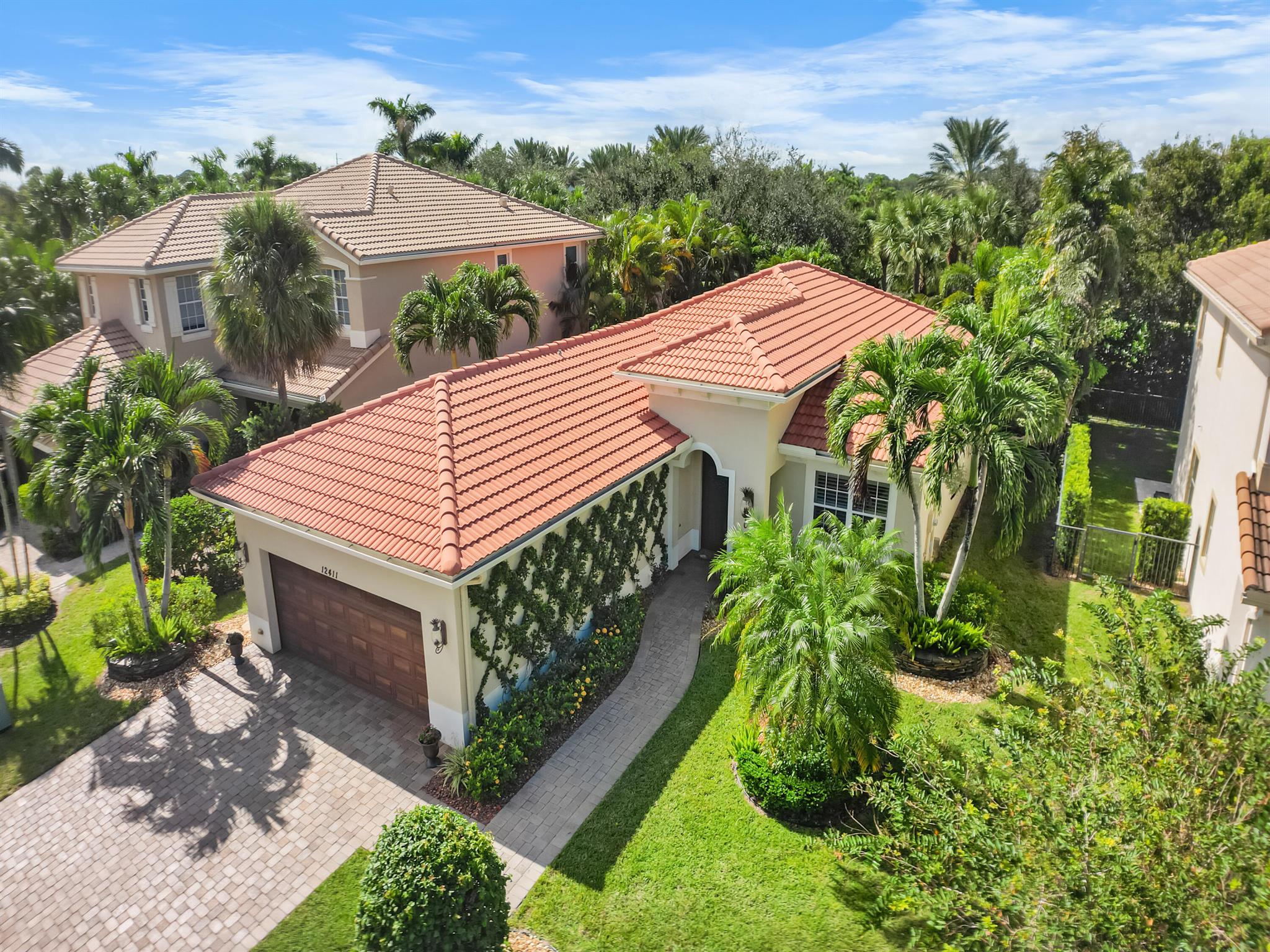 Welcome to Your Dream Home in Paloma at the Gardens!This stunning 4-bedroom, 1-story residence in the highly desirable Paloma community of Palm Beach Gardens is a perfect blend of luxury and comfort. The versatile 4th bedroom, currently used as a home office, offers flexibility to suit your lifestyle.As you enter, you're greeted by a grand foyer featuring a vaulted ceiling and an elegant chandelier, setting the tone for the rest of the home. Crown molding adds a touch of sophistication throughout, while the spacious living areas flow seamlessly into the outdoor oasis.The expansive covered patio, adorned with beautiful travertine tiles, provides an ideal space for entertaining or relaxing. The custom landscaping in both the front and back yards, complete with strategically placed lighting, creates a picturesque setting day and night.
This home is built for modern living with:
"Hurricane impact windows and doors for safety and peace of mind
"EV car charger for eco-friendly convenience
"Portable generator hookup with transfer switches for added resilience
"Spray foam insulation to keep your home cool and energy-efficient
Exceptional Community Amenities: The HOA includes incredible benefits that enhance your lifestyle:
"High-speed AT&amp;T fiber internet (300mb/s download and upload)
"Direct TV stream with premium channels including HBO, Showtime, and Cinemax
"ADT alarm monitoring services for security
"Lawn and shrub maintenance for effortless outdoor care
"Access to a beautiful clubhouse featuring a gym, heated resort-style pool, spa, and shaded playground for kids
Paloma is a gated community that embraces a vibrant lifestyle. Surrounded by lush tropical landscapes, with over 30% of the area preserved as open space, it offers a serene environment for relaxation and recreation.
Conveniently located near The Gardens Mall, Downtown at the Gardens, and Midtown at the Gardens, you'll enjoy over 160 specialty shops and restaurants at your fingertips. Plus, the pristine powder-white sands and crystal-clear waters of Florida's beaches are just minutes away.
Don't miss out on this incredible opportunity to live in paradise! Schedule your private tour today and experience the lifestyle Paloma at the Gardens has to offer!