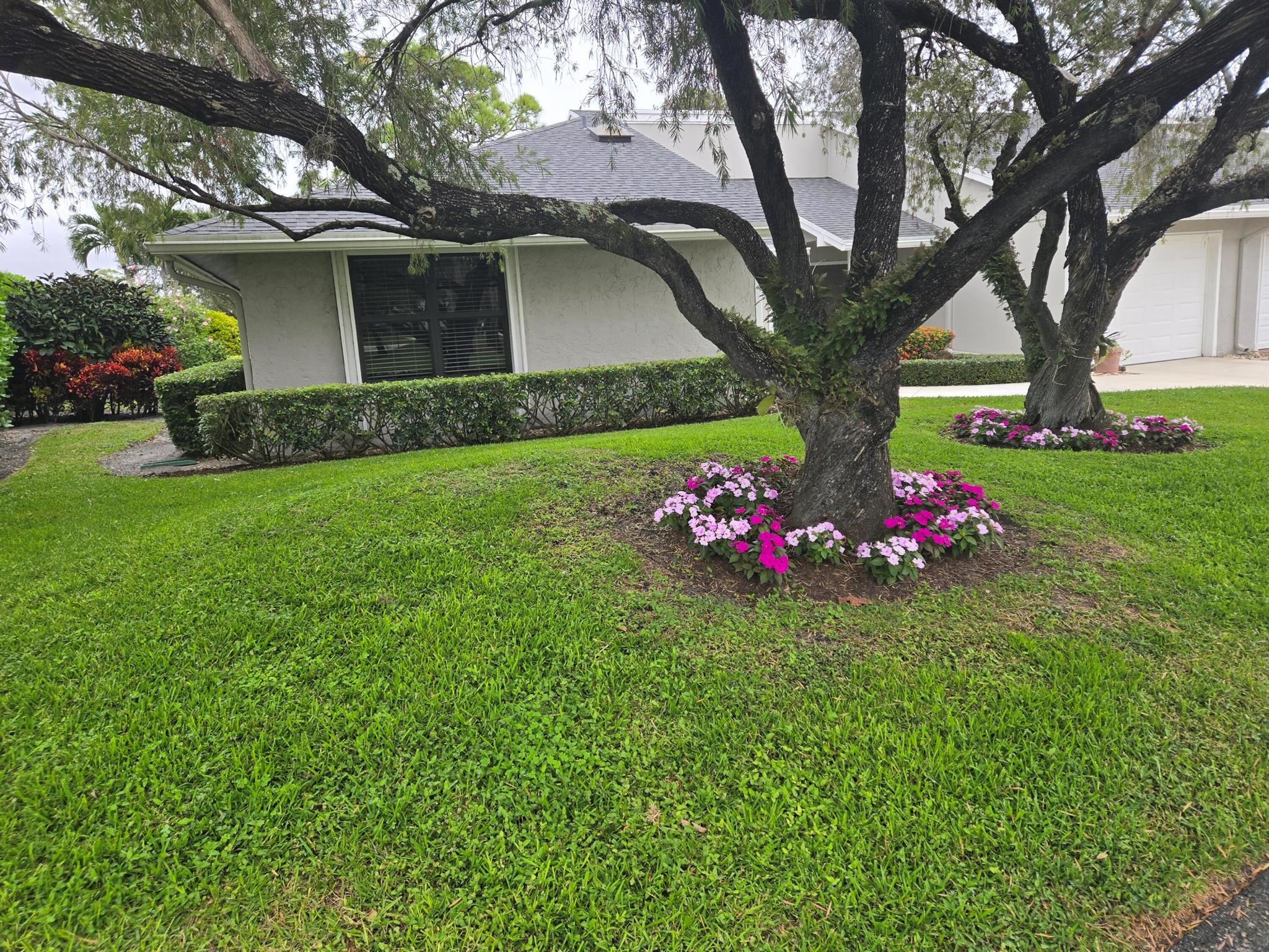 As you enter this beautifully maintained, 3 bedroom, 2 bath villa, you are met with an expansive view over two fairways of the recently renovated 18 hole Fazio golf course. Custom walk in closets, updated (2021) kitchen appliances and baths. 2020 roof, 2017 A/C, complete impact glass. Separate golf cart garage.Eastpointe is a secure, 24 hour manned security with two golf courses, tennis, pickleball, playground and a new state of the art fitness center and resort pools including hot tubs and fire pits.The ability to live an ''elegant lifestyle'' at a reasonable price.