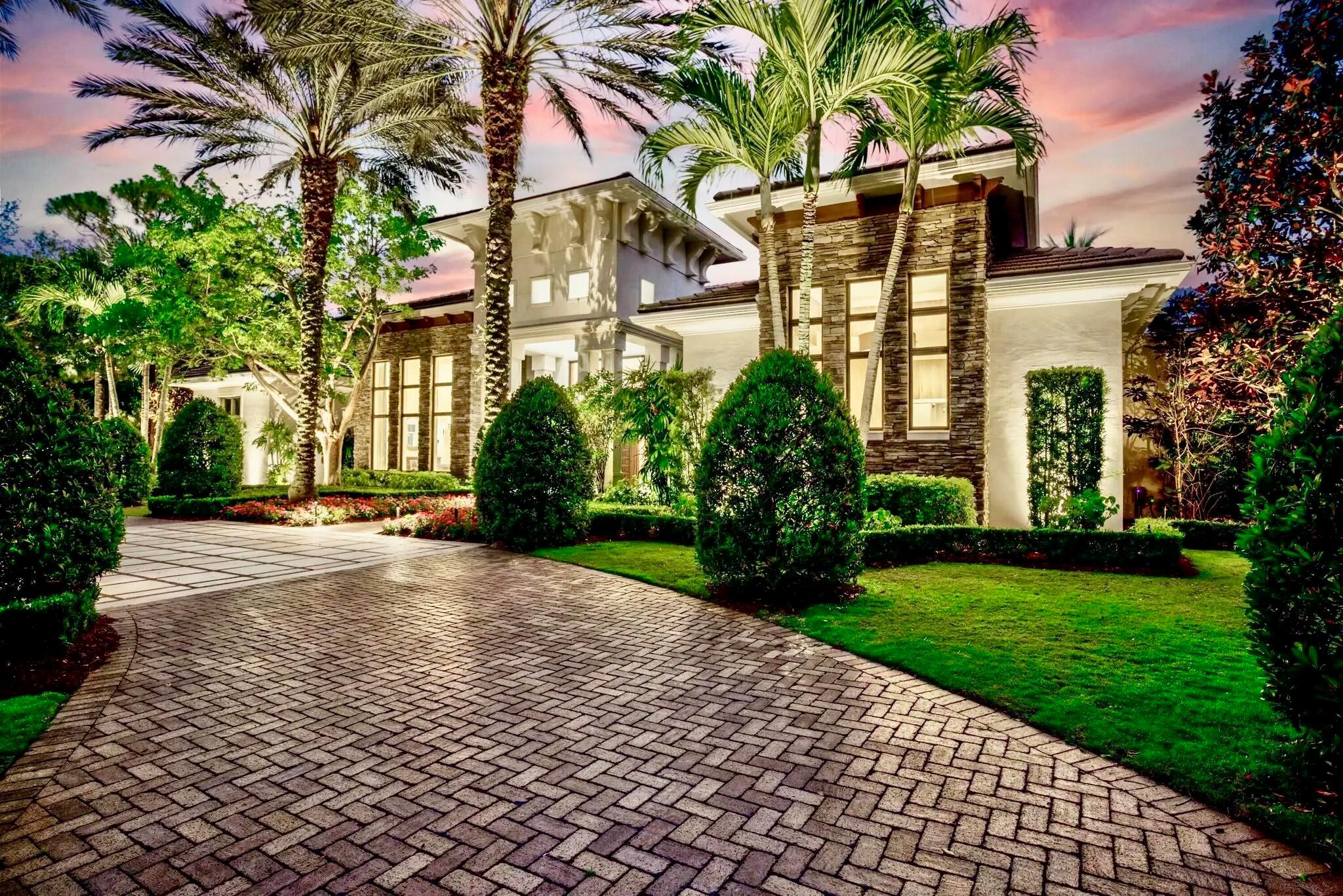 This secluded, single-story custom luxury home is situated on one of the most coveted streets in Old Palm Golf Club, where each homesite spans a full acre. Positioned at the end of a cul-de-sac and backing onto one of Old Palm's private nature preserves, this residence enjoys one of the finest lots in the community. Old Palm Golf Club, an exclusive gated enclave in Palm Beach Gardens, features a newly renovated Raymond Floyd Signature golf course, an upgraded clubhouse, and a state-of-the-art 20,000-square-foot lifestyle center. Club amenities include a new fitness center, spa, resort-style pool, lap pool, fine dining, sports bar, and guest casitas. All these exceptional features are just moments from your doorstep. This is a very private lot with a backyard oasis that faces due south, ideal for southern exposure. There is an extra large covered logia that includes a full outdoor kitchen with a gas grill, ice maker, and bar that seats seven, a dining space, and a living room space in front of a fireplace with a television above.  Walk off the covered space to a custom heated pool and spa with a tranquil rock waterfall and relax by the firepit with your favorite glass of red under the stars, or enjoy the 1,100sf synthetic turfed putting green and synthetic chipping stations strategically placed around the yard. With over an acre of land and large fenced in backyard of zoysia grass, there is ample entertainment for everyone at this perfect recreational venue.  

The grounds themselves are absolutely stunning! Every attention to detail has been paid to this meticulous landscape package. Lazy oaks and magnolias adorn the front yard, giving the front elevation a modern low country feel. In the evenings, the landscape comes alive with a new, state-of-the-art low voltage system of lights that turns this backyard into pure paradise. Perfectly positioned flowers, annuals, and shrubbery finish the look and give this home the feel of a perfectly manicured estate.

The home's interior is modern, spacious and open. There is a lot of natural light with the oversized sliding glass windows and doors that are all impact. The custom ceiling details feature a combination of fine crafted level 5 drywall coffers and solid maple and mahogany beams. The millwork package is second to none, and this home's additional spaces include a study, gym, custom fireplace, wine room and a home theater with upgraded electronics. Equally as impressive is the large open kitchen with double islands, double sinks, double dishwashers, professional grade Thermador appliances, a reverse osmosis water filtration system, quartz counters and custom wood cabinetry. Just off the kitchen and family room is the wet bar, perfect for entertaining inside and out including both an icemaker and wine refrigeration. Music can be played throughout this beautiful home with the included Sonos Wi-Fi controlled sound system. 

For those who love to entertain overnight guests, this residence features a true guest wing with a private entrance, formal living room, breakfast bar and 3 private guest suites, each with its own full guest bath. 

Both the the living room and kitchen have just been totally refurbished and updated. The roof is brand new, the washer/dryer, ice makers, and the outdoor refrigerator are new, 4 A/C units were installed in 2022, tankless water heaters and a water filtration system also installed in 2022, and new interior and exterior paint throughout that embraces the entire home. New low voltage landscape lighting encompasses the entire property, plus new landscaping, and all new epoxy garage floors.  If the power goes out, do not despair. This home is backed up with a full house Generac Generator. 

The Old Palm Golf Club membership is available, but not mandatory for this home. Look no further... you have found paradise!