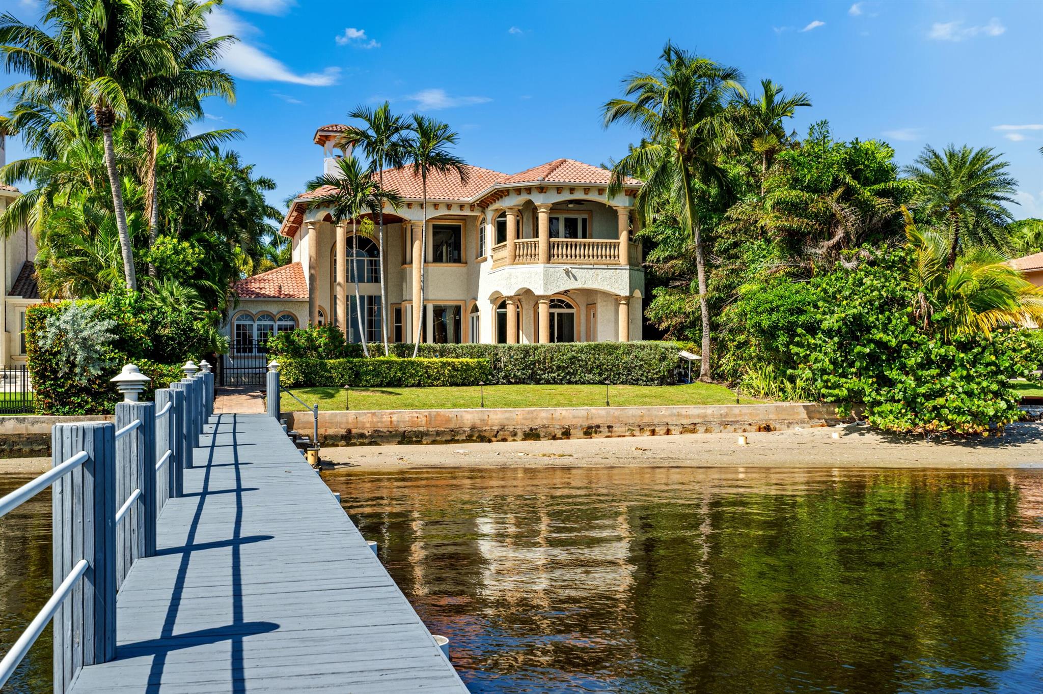 Evoking the timeless allure of classic European architecture, this direct-Intracoastal masterpiece showcases unparalleled quality and attention to detail along with dynamic water views from all main rooms. Decorative appointments include marble and pecky-cypress. Indoor/outdoor living is exceptional, with two loggias, large pool, private beach, and dock accommodating up to a 50-foot boat. LOCATION: 

318 South Lake Drive, Lantana, Florida: Striking a balance between the tranquil allure of the ocean and the vibrancy of an active lifestyle, Lantana is a charming coastal town lauded for its pristine beaches, diverse range of upscale amenities, and keen sense of community.

PROPERTY: 
 
Completely walled with a perimeter visual monitoring system and an electric gate offering privacy and security, the large brick-paved motor court, shaded by beautiful mature trees, fronts the residence and three-car garage. Highlighted by a private beach with 76 feet directly on the Intracoastal, the residence's outdoor entertaining spaces invite the coveted outdoor/indoor waterfront-style of living. The two-story loggia, off the salon, with a summer kitchen and grill, as well as a smaller loggia, accessed from the great room, overlook the heated salt-chlorination pool with a spill over spa. Perfect for watersport enthusiasts, the full-service dock can accommodate up to a 50-foot vessel, and an additional advantage, the property offers easy an approach to the ocean with no fixed bridges. Added conveniences are a cabana bath and an outdoor shower.  

RESIDENCE:  

Evoking the timeless allure of classic European architecture, this direct-Intracoastal six-bedroom masterpiece, with 7,029 +/- total square feet, conveys unparalleled quality and attention to detail combined with dynamic water views from all the main rooms. The grand two-story atrium entry, showcasing stone-finished walls and a dramatic marble staircase, immediately dazzles, while the double-height mezzanine-style salon, appointed in marble and pecky cypress, impresses. Serving as a sensational focal point, the salon's magnificent gas fireplace is embellished by a massive carved coral-stone mantel bookended by art alcoves. The dining room, an intimate space, is crowned by a decorative ceiling and offers pretty garden views, while the epicurean kitchen is centered on an oversized chef's workstation island and an eat-in bar with pull-up seating that invites casual entertaining. Fitted with professional-grade appliances, granite counters, custom wood cabinetry and a pantry, the kitchen connects to the water-view great room featuring a coffered ceiling, the breakfast bay overlooking the pool and Intracoastal, and the full-service wet bar with a wine cooler. Completing the first-floor layout are four guest bedroom suites, with one finished with bookcases and currently serving as a library. The stairway just off the foyer, and elevator, that is nestled in the laundry room, ascend to the multi-purpose game room/office and the primary suite. A serene retreat, the expansive primary bedroom features wood flooring, a pecky-cypress ceiling, French doors that open to an Intracoastal-view private balcony, and a bay sitting area. The suite comprises two custom-fitted walk-in closets and a spa-inspired bathroom appointed with marble and granite and fitted with custom cabinetry, dual sinks, a shower, Jacuzzi tub and two water-closets. Completing the floorplan is a laundry, and amenities throughout include a whole house gas generator, gas accommodation, water-filtration system, central-vacuum system and impact-glass windows and doors. Truly a must-see trophy property, this remarkable estate is a sublime study in timeless luxury, sophistication and ease.


DISCLAIMER: Information published or otherwise provided by the listing company and its representatives including but not limited to prices, measurements, square footages, lot sizes, calculations, statistics, and videos are deemed reliable but are not guaranteed and are subject to errors, omissions or changes without notice. All such information should be independently verified by any prospective purchaser or seller. Parties should perform their own due diligence to verify such information prior to a sale or listing. Listing company expressly disclaims any warranty or representation regarding such information. Prices published are either list price, sold price, and/or last asking price. The listing company participates in the Multiple Listing Service and IDX. The properties published as listed and sold are not necessarily exclusive to listing company and may be listed or have sold with other members of the Multiple Listing Service. Transactions where listing company represented both buyers and sellers are calculated as two sales. "No payments made until title passes" Some affiliations may not be applicable to certain geographic areas. If your property is currently listed with another broker, please disregard any solicitation for services. Information published or otherwise provided by seller, listing company or its representatives is deemed reliable but are not guaranteed and subject to errors, omissions, or changes without notice. Copyright 2024 by the listing company. All Rights Reserved.