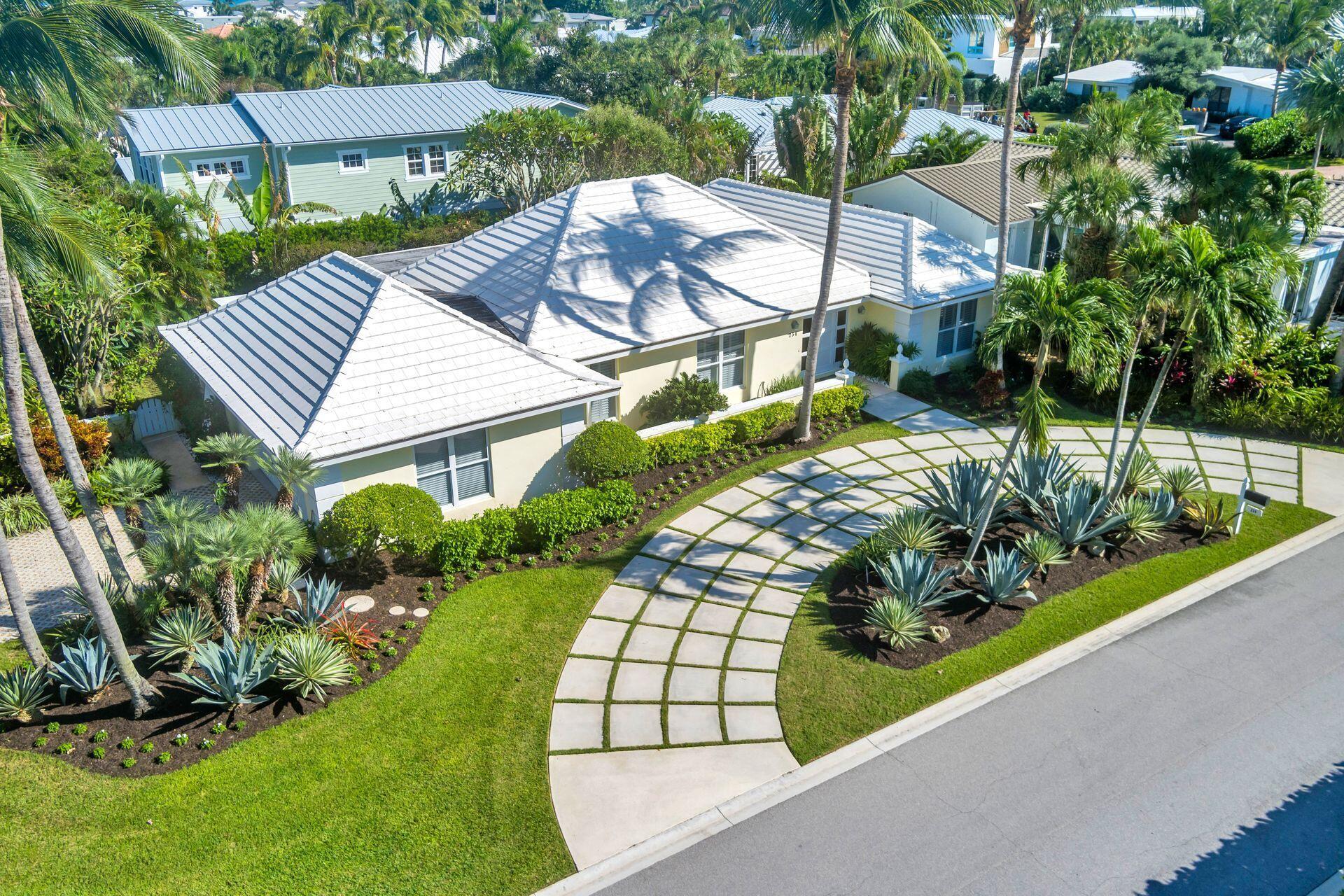 Welcome to this Classic Bermuda-Style home in Jupiter Inlet Colony. Situated on a corner lot this home boasts 4 bedrooms, volume ceilings and 2.5 baths. The spacious kitchen opens to the family room with added living and dining rooms. Enjoy your screened in back patio overlooking the beautiful garden and dip into your in-ground hot tub. Stroll the short walk to the beach and use the outdoor shower upon return. This home offers a 2 car garage and a sweeping circular drive. Impact windows and doors help secure the home. JIC has its own police force and governing body dedicated to the safety and well being of its residents. Fine dining, world-class golf and fishing nearby. 20 mins to Witham Air field & 30 mins to PBI airport. Luxury Island living at its finest in Northern Palm Beach County.