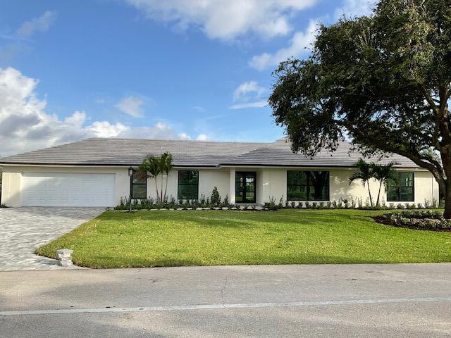 This magnificent executive home is almost complete. This modern and elegant home has been remodeled from the ground up!  This is as close as you can get to a newly built home- as everything has been meticulously redone, electric, plumbing, roof, kitchen, baths, drywall, stucco, landscaping, fence, new pavered driveway and patio, and new modern impact windows and doors. This oversized lot has one of the best views of the golf course you are ever going to get, and the huge fenced in backyard with new paver patio has plenty of room to add a pool and putting green! This estate offers 3 bedrooms plus an office/4th bedroom and 3.5 bathrooms. The spacious floor plan includes a chef's dream kitchen with an expansive island opening up to the living room, all new modern fixtures, cabinets and