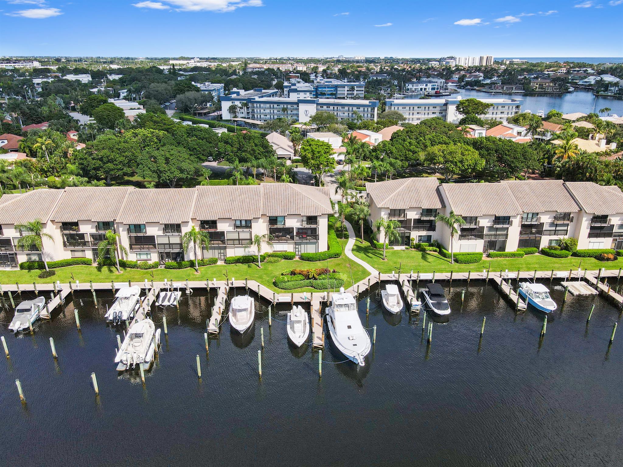 RARELY AVAILABLE, CORNER TOWNHOUSE WITH DEEDED DOCK. This townhouse is a fantastic opportunity for water lovers! With its prime location on a deep canal & easy access to the ocean, it's perfect for boating enthusiasts. The fact that it's being sold fully furnished makes it even more appealing--just move right in!The spacious layout, incl. 3 bedrooms & a generous balcony, offers plenty of room to relax & entertain. The renovated dock is a nice touch, & having amenities like a clubhouse, pool, & gym enhances the living experience. If you're into waterfront living, enjoy beautiful views, this place could be a dream come true! NO FIXED BRIDGES which enables easy access to the ocean. Newer A/C, water heater, hurricane shutters, built in wet bar w/wine cooler, guest bathroom