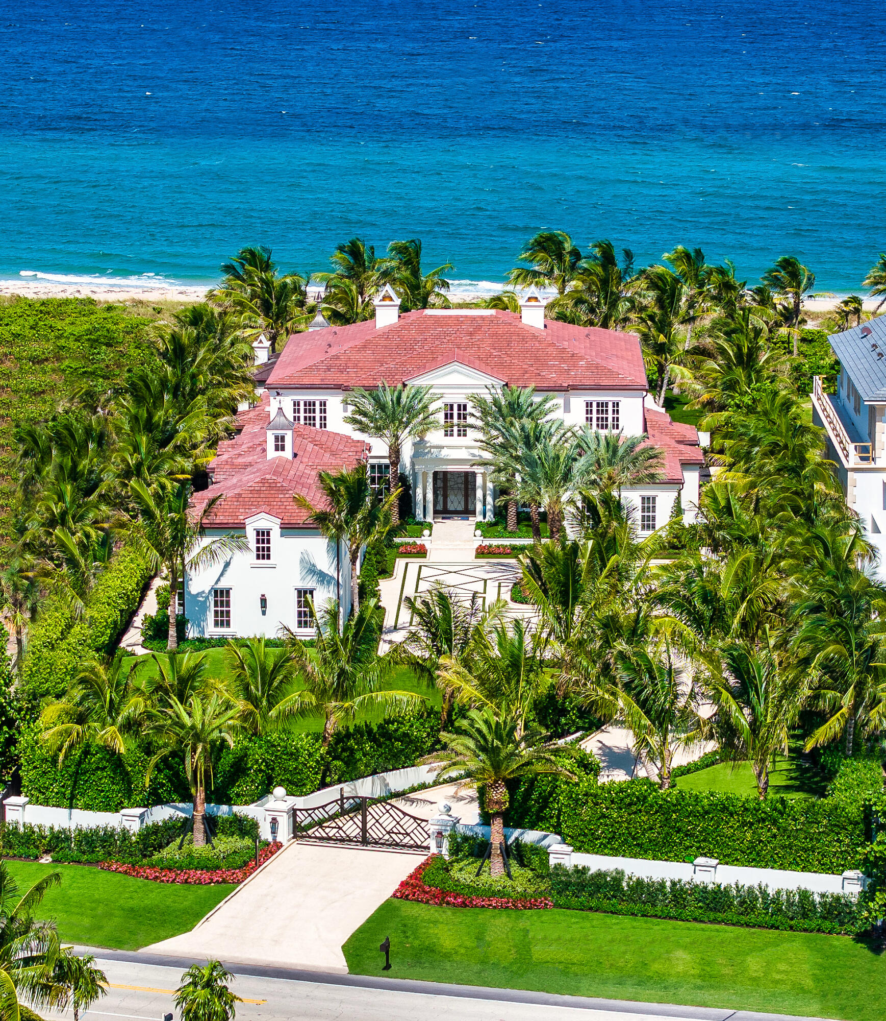 Ideally situated on 120'+/- feet of direct oceanfront in the exclusive Estate District of Delray Beach, this magnificent new residence redefines ultraluxury living, gracious entertaining. Masterfully crafted by renowned builder Mark Timothy Luxury Homes, with stunning interiors by Jeffrey Strasser, this residence sets a new standard for living beautifully, with a plan that ensures personal privacy, craftsmanship and materials that assure peace of mind, amenities that provide the perfect beachfront lifestyle. New Tropical Georgian-Inspired Gated Oceanfront Estate
Delray Beach, Florida

Ideally situated on 120'-¦ feet of direct oceanfront in the exclusive Estate District of Delray Beach, this magnificent new residence redefines ultraluxury living, gracious entertaining.

Masterfully crafted by renowned builder Mark Timothy Luxury Homes, with stunning interiors by Jeffrey Strasser, this residence sets a new standard for living beautifully, with a plan that ensures personal privacy, craftsmanship and materials that assure peace of mind, amenities that provide the perfect beachfront lifestyle.

Luxurious Innovation
One expects such exceptional features and finishes as volume detailed ceilings, custom cabinetry and wallpaper, boutique-crafted closets in a bespoke property of this magnitude. Even so, it surprises and delights with such innovative features as the scalloped, glass railed, circular concrete grand staircase; underlit drop tray ceiling with chandelier; stunning freestanding fireplace; and apr+¿s beach surfboard outdoor shower. 
  
Creature Comforts 
A porte cochere guarantees a comfortably dry arrival. Smarthouse technology delivers fingertip convenience and control. Sliding doors ensure well-served and undisturbed formal dining. Poolside pavilions (air conditioned) with nano doors facilitate indoor/outdoor all-season living. The full cabana bath enables comfort by the pool. 

Protected Privacy
This residence is of a size that ensures personal space, with a plan that assures personal privacy, and built-in safeguards to support security and viability. Come what may, this walled, gated property on a coveted oceanfront lot offers a secure retreat. One where space is luxurious, and the panoramic ocean views daily expand your perspective on what constitutes idyllic living.
Location
South Ocean Boulevard, Delray Beach, Florida. Historic Delray Beach is a beautifully preserved oceanfront community in the heart of South Florida's famed Gold Coast. This ultraluxury residence, directly fronting 120'-¦ of public ocean beachfront, is situated in a highly coveted location along A1A, midway between Linton and Atlantic Boulevards, just minutes from the eclectic shops, cafes and restaurants that line vibrant Atlantic Avenue. It is barely 10-¦ minutes from Boca Raton's private executive airport, and an easy 25-¦ minute commute to Palm Beach International Airport. 

Property
Truly an idyllic oasis, this gated walled property sits 19.5-¦ feet above sea level on a manicured estate-sized lot of well over an acre, verdantly landscaped with privacy hedges, expansive no-maintenance turf, tropical shrubs, and coconut palms. The residence is set back from its 120-¦ feet of direct Atlantic Ocean beachfront behind protective dunes evocative of The Hamptons. It is introduced by a serpentine drive of Tabby concrete leading to an auto plaza that provides ample guest parking, with additional parking under the porte cochere between the twin two-car garages. 

The rear entertaining area is comprised of two glass enclosed air-conditioned pavilions. One connects the family room and the other connects the grand salon to the oceanside pool area via French nano doors (accordion fold sliders) that blur the line between indoor/outdoor living. The family room pavilion (pecky cypress ceiling, terazzo floor) has a built-in summer kitchen (Alfresco grill, Scotsman icemaker, mini fridge) for alfresco dining and conversation.  Both pavilions open to a resort-style 30' x 60' heated saltwater pool with dual sun shelves. An expansive turf lawn beyond the pool area is framed with hedges that create a privacy barrier without obscuring the breath-taking panoramic ocean view.

Residence
First Level: This light-infused, open-plan residence is defined by its stellar lines, superb finishes, volume detailed ceilings, high-end cabinetry, top-tier appliances, expansive indoor/outdoor all-season pavilions, and covered balcony. 
Guests arrive in a 2-story foyer with marble floor and dramatic glass railed grand circular cement staircase. They look directly into a sun-infused grand salon with a stunning freestanding fireplace. At the heart of the residence, the grand salon is bordered by a professional sit-down wet bar and expansive poolside pavilion with endless ocean views. 
The north wing encompasses a formal dining room for 10, beautifully served by a gourmet chef's island kitchen with custom cabinetry, quartz counters, top-tier Sub-Zero and Wolf appliances, and a spacious walk-in pantry, open to a separate breakfast area and the family room beyond, with accordion sliders to an air conditioned pavilion with full summer kitchen for alfresco ocean/poolside dining, and a cabana bath. Twin two-car garages separated by a porte cochere, bath, laundry, and back staircase complete this wing. 
The south wing is dedicated to the secluded ocean/pool view primary suite with morning bar, expansive bedroom with under-lit drop ceiling and sliders to the pool, his/hers spa-inspired marble baths (hers with pocket glass doors opening to a free-standing soaking tub perched on a marble base) amid impressive boutique fitted walk-in closets. A powder room, and a second ensuite  (usable as a guestroom or private office) complete this wing. 
Second Level: The second level mirrors the first, with a central loft game room opening to an expansive ocean/pool-view covered balcony; two front-facing guest ensuites; a second laundry; and ocean/pool-view VIP and guest ensuites.  Atop the back staircase, over the twin garages, the elongated 1990-¦ square foot bonus room with vaulted ceiling and storage is plumbed for two bathrooms and easily converts to a guesthouse. 

Special Features: foundation-to-roof concrete structure, La Finestra impact windows/doors, 100 KW whole-house Kohler generator, two 75-gallon hot water heaters, 10 Lennox AC units in main residence and 2 Mitsubishi garage units, volume detailed ceilings, oak/marble/porcelain/tile/terrazzo floors, windows pre-wired for auto blinds, solid core Tru Stile interior doors, elevator, fire sprinklers, smart house technology, top-tier wallpapers, individual bedroom thermostats, two Electrolux utility rooms, full cabana bath, surfboard outdoor shower, glass-tiled 7' deep pool with pebble Brilliance coating has 2 gas heaters.


DISCLAIMER: Information published or otherwise provided by the listing company and its representatives including but not limited to prices, measurements, square footages, lot sizes, calculations, statistics, and videos are deemed reliable but are not guaranteed and are subject to errors, omissions or changes without notice. All such information should be independently verified by any prospective purchaser or seller. Parties should perform their own due diligence to verify such information prior to a sale or listing. Listing company expressly disclaims any warranty or representation regarding such information. Prices published are either list price, sold price, and/or last asking price. The listing company participates in the Multiple Listing Service and IDX. The properties published as listed and sold are not necessarily exclusive to listing company and may be listed or have sold with other members of the Multiple Listing Service. Transactions where listing company represented both buyers and sellers are calculated as two sales. "No payments made until title passes" Some affiliations may not be applicable to certain geographic areas. If your property is currently listed with another broker, please disregard any solicitation for services. Information published or otherwise provided by seller, listing company or its representatives is deemed reliable but are not guaranteed and subject to errors, omissions, or changes without notice. Copyright 2024 by the listing company. All Rights Reserved.