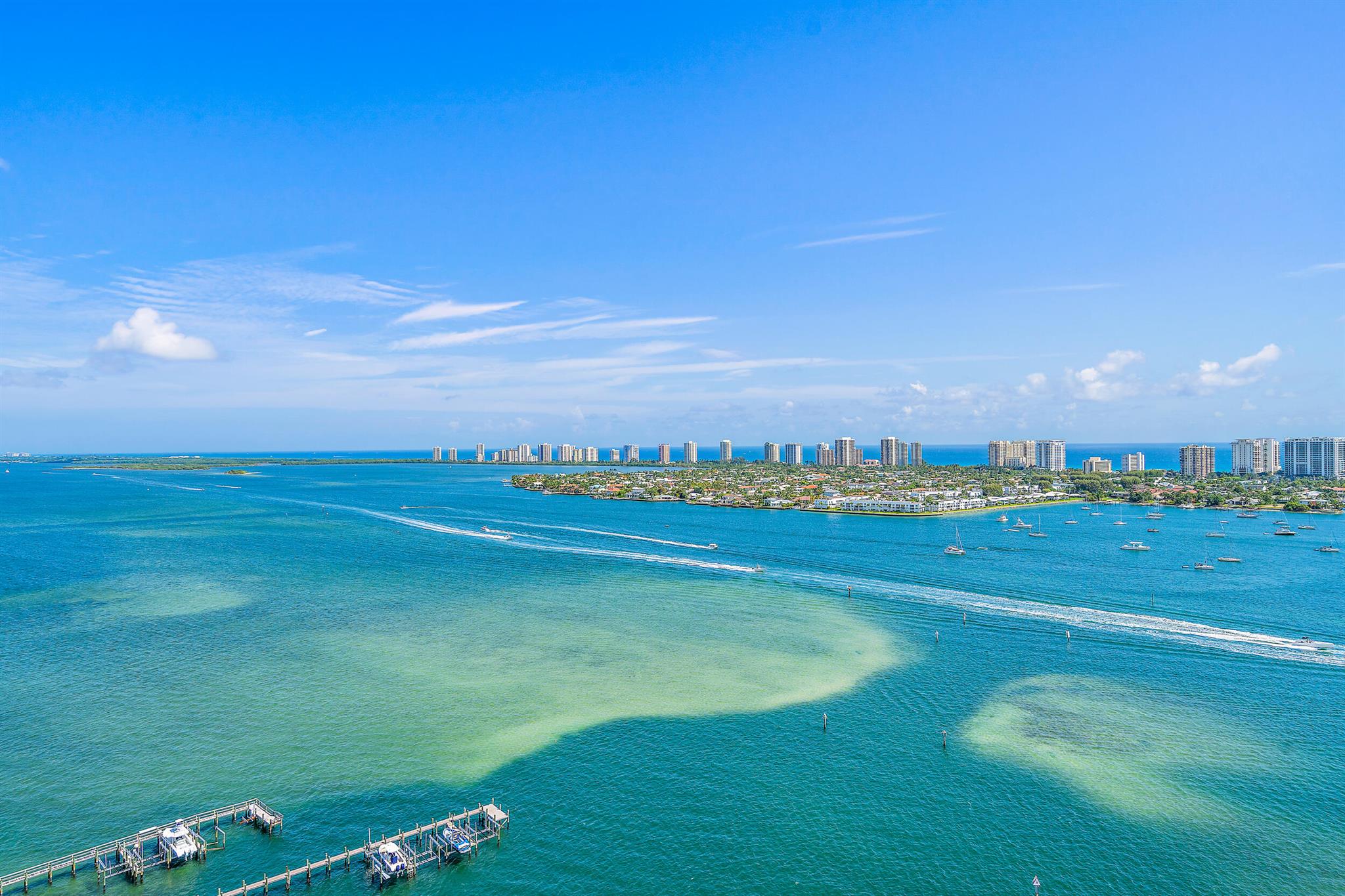 If you have been searching for a spectacular waterfront PENTHOUSE in Marina Grande, you are in luck! This spacious condo has 3 bedrooms, 3 full bathrooms, gorgeous upgrades, and STUNNING views of the ocean & intracoastal! Step inside of this resort-style gem to be swept off your feet by the light and bright, elegant feel complemented by soaring 11 ft ceilings, hardwood flooring in the main areas and new wainscoting and trim throughout. Continue into the home to be dazzled by the beautiful modern kitchen with stainless steel appliances and skylight, decorative accent wall in the great room, and HUGE sliding glass doors leading to the perfect outdoor patio overlooking the turquoise waters. Retreat to your huge master bedroom with breathtaking water views! decorative accent wall, walk-in closet and a gorgeous ensuite bathroom with a skylight, marble tub, separate shower, and double vanities. Each bedroom boasts views of the water and each bathroom features new frameless shower doors.

Additional features include a brand new dishwasher and refrigerator in the kitchen and new carpet in all 3 bedrooms. 

Live the relaxing South Florida resort lifestyle with all of the amenities you want and more including IN-UNIT washer &amp; dryer, 24/7 manned-gate, valet parking, covered garage parking, card rooms, storage unit, social salon, and a BRAND NEW rooftop oasis with pool, spa, fire pits, grills, fitness center, sundeck and ample seating where you can take in panoramic ocean and intracoastal views. Marina Grande also just built a NEW pickleball court as well as a new tennis court!

2650 Lake Shore Drive 2403 is situated in the PERFECT location on the 24th floor of Marina Grande with the most SPECTACULAR views of the ocean AND the intracoastal PLUS it is just short drive to the area's pristine beaches, extensive shopping, golf courses, boating &amp; water sports, and fine dining options.

Don't miss your opportunity to live in this penthouse beauty!