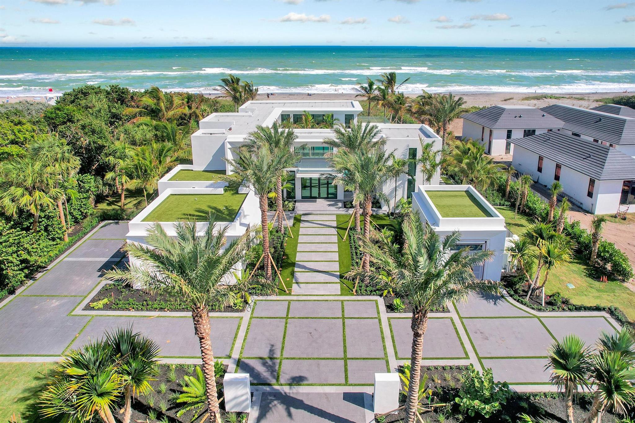 Discover the rare allure of a brand-new beachfront gem on the pristine shores of Jupiter Island. This stunning contemporary residence, with 6,500 square feet of meticulously crafted, air-conditioned living space, offers uninterrupted ocean views from every corner. Featuring five spacious bedrooms and five and a half elegantly appointed bathrooms, this concrete and steel constructed fortress is a true masterpiece of modern design. It seamlessly combines style with functionality, boasting floor-to-ceiling glass throughout that captures breathtaking views and fills the home with natural light. Created with the finest materials and exquisite finishes, this architectural marvel is the vision of the esteemed Affinity Architects, brought to life by one of the top local builder, Coastal Property Every element of this home reflects a commitment to unparalleled quality and timeless elegance, creating an oasis where you can unwind and embrace the ultimate seaside lifestyle.
Listed at $21,000,000, this property is more than a home; it's an invitation to own a private piece of paradise in one of the world's most exclusive coastal settings. Jupiter Island is renowned for its serene, luxurious ambiance, with fewer than 500 homes gracing the barrier island and offering expansive acre plus lot size with the Atlantic ocean to the east and the Intracoastal to the west. Jupiter Island provides a haven of refined tranquility for those seeking an elevated lifestyle. Despite its peaceful seclusion, Jupiter Island is close to upscale shopping, fine dining, world class golf clubs and accessible airports, perfectly balancing tranquility with convenience. Jupiter Island offers a lifestyle beyond compare, cherished by the world's elite and now awaiting you. Seize your chance to make this dream home your reality.